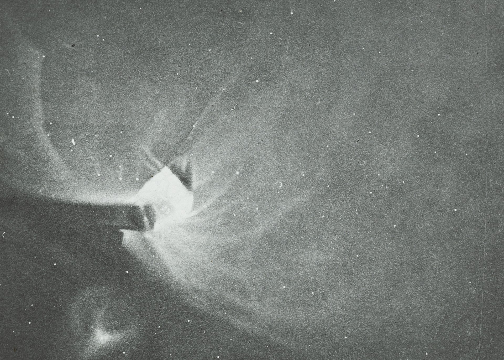 Photograph of a lantern slide depicting a black and white drawing of Orion made of glass and paper.