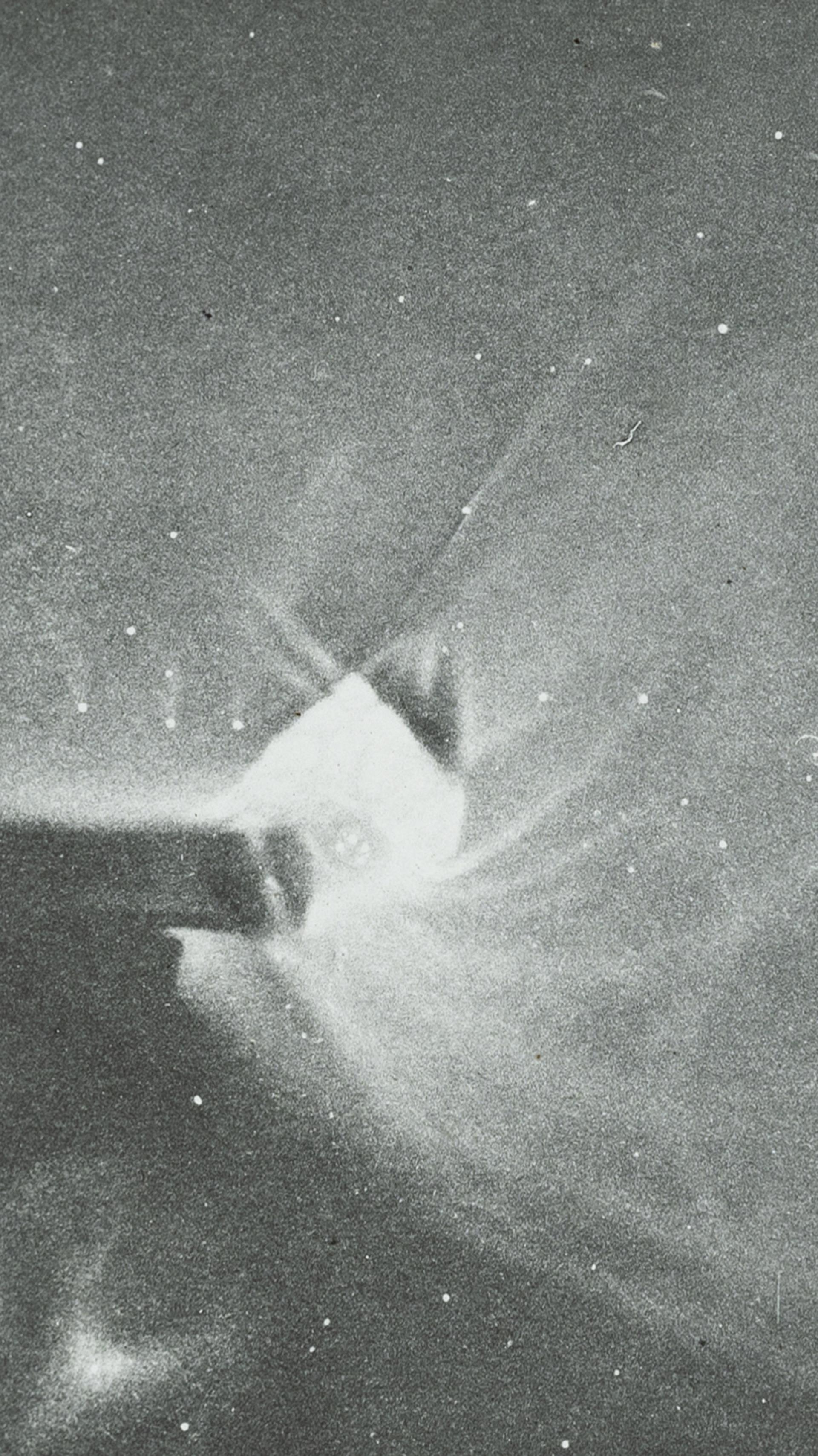 Photograph of a lantern slide depicting a black and white drawing of Orion made of glass and paper.