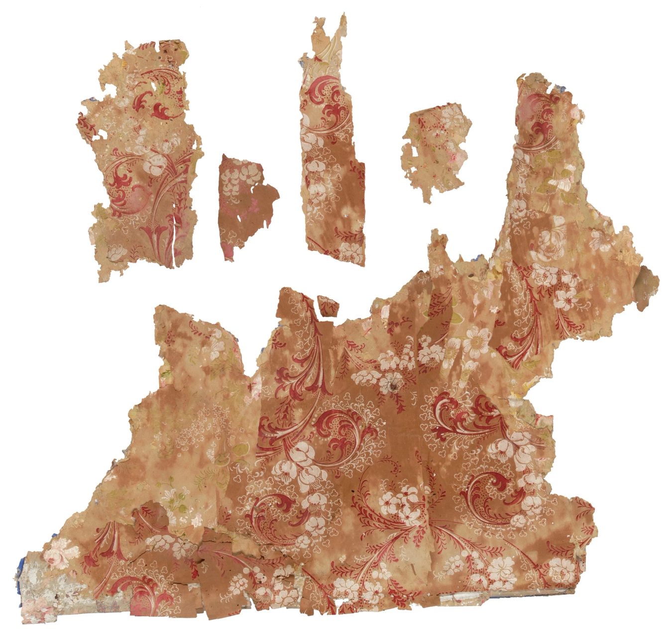 Wallpaper fragments with a brown background and floral red and white print.