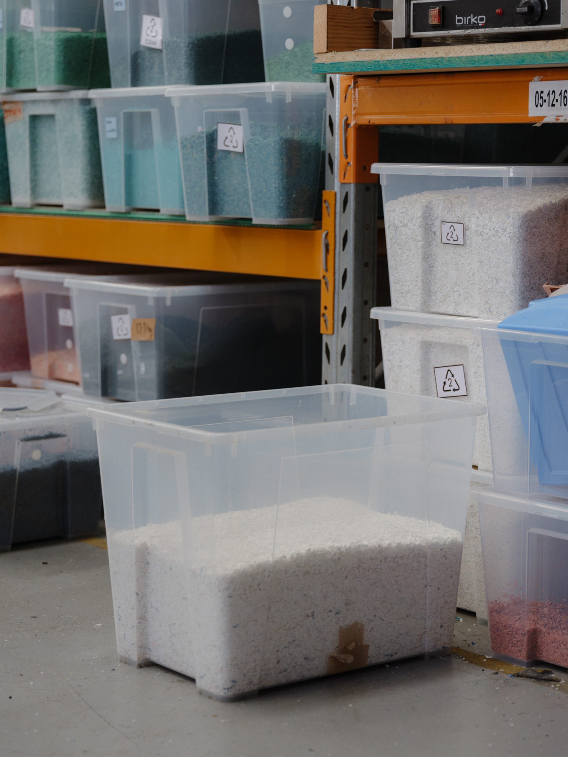 Boxes of plastic bits organised into shelving units.