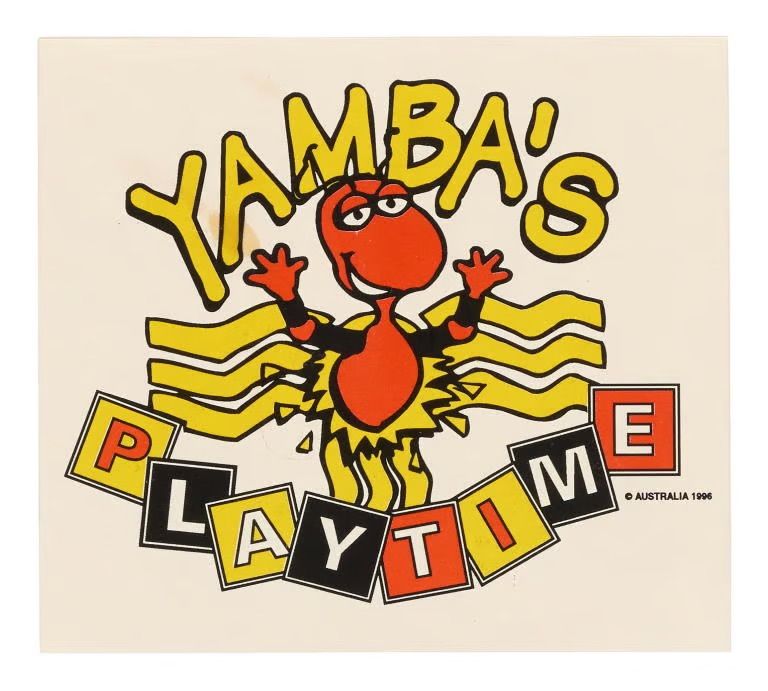Illustrated sticker of a honey ant. ‘Yamba's Playtime' is printed above and below the illustration. The sticker is printed in red, black and yellow on a white ground.