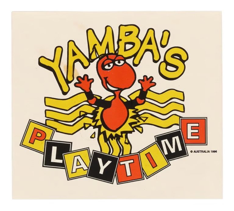 Illustrated sticker of a honey ant. ‘Yamba's Playtime' is printed above and below the illustration. The sticker is printed in red, black and yellow on a white ground.