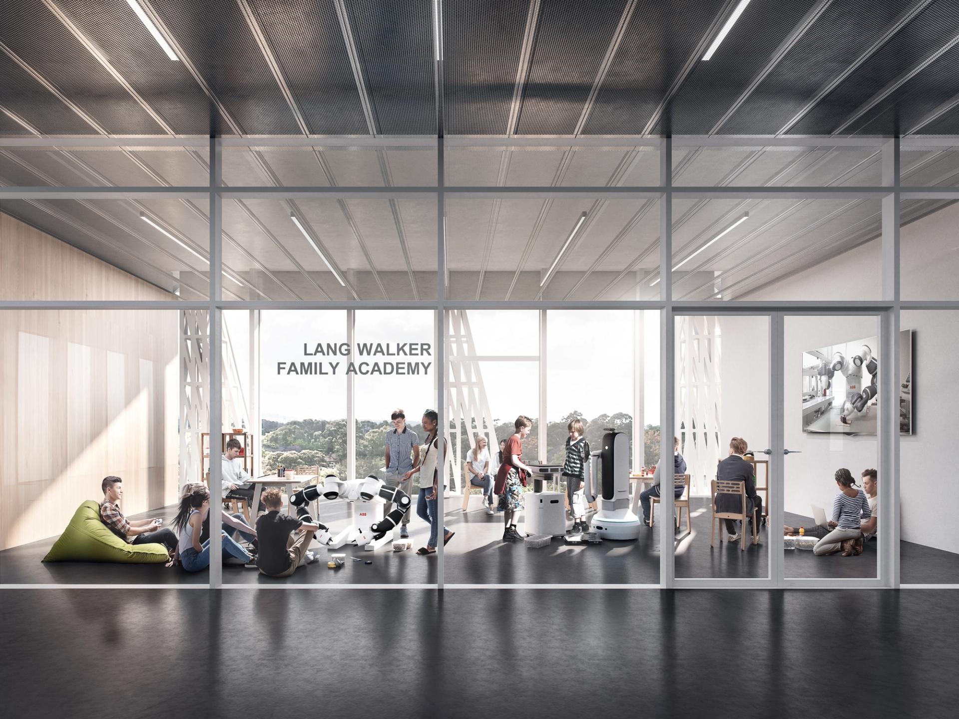 A group of students are in a large room with floor to ceiling windows.