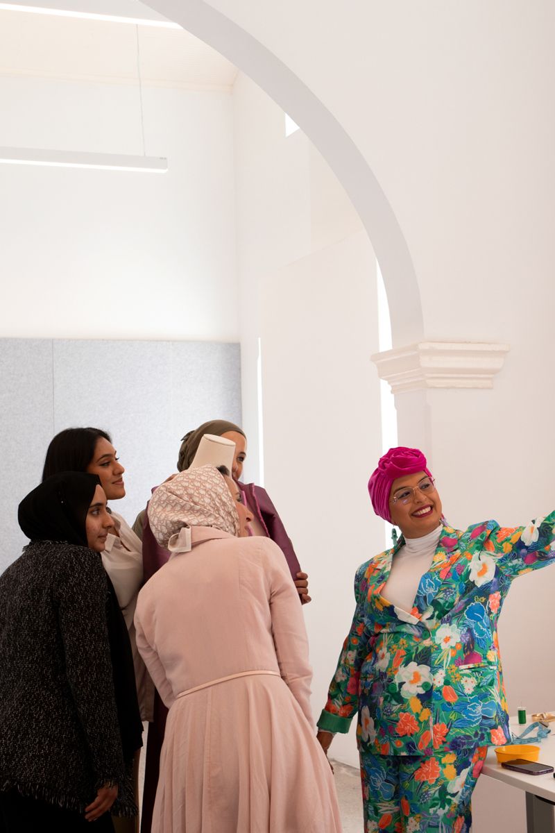 Figures taking a selfie together and leaning in