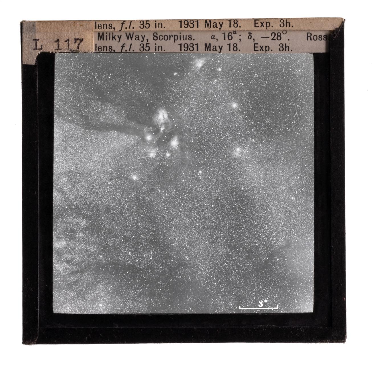 Photograph of a glass lantern slide used for teaching astronomy depicting the Milky Way and Scorpius.