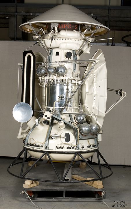 A medium sized model space craft including small satellite attached to the left side.