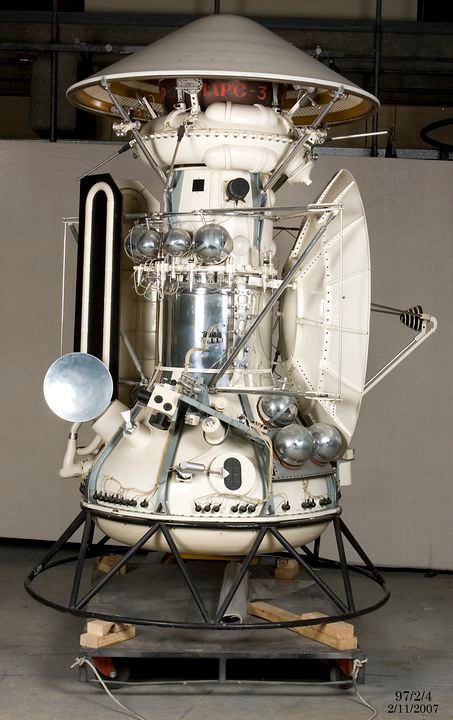 A medium sized model space craft including small satellite attached to the left side.
