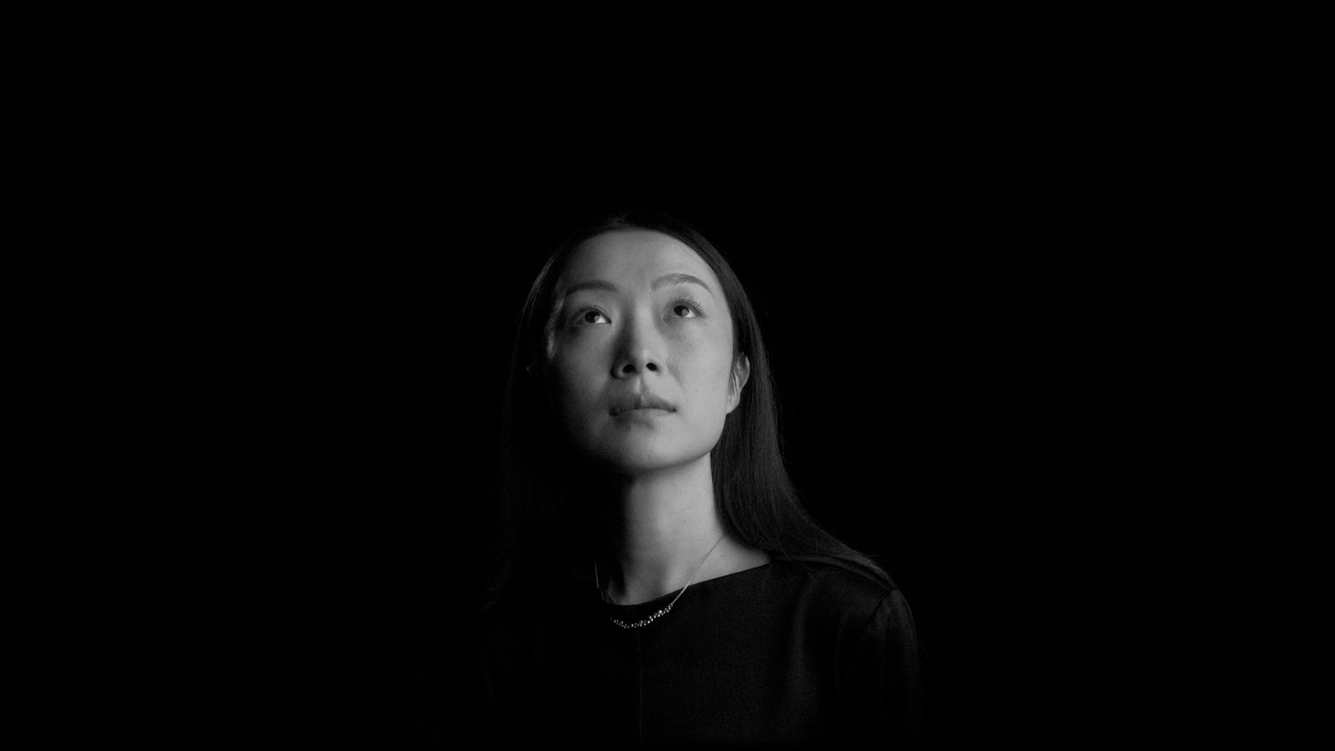 Half lit face of a woman.