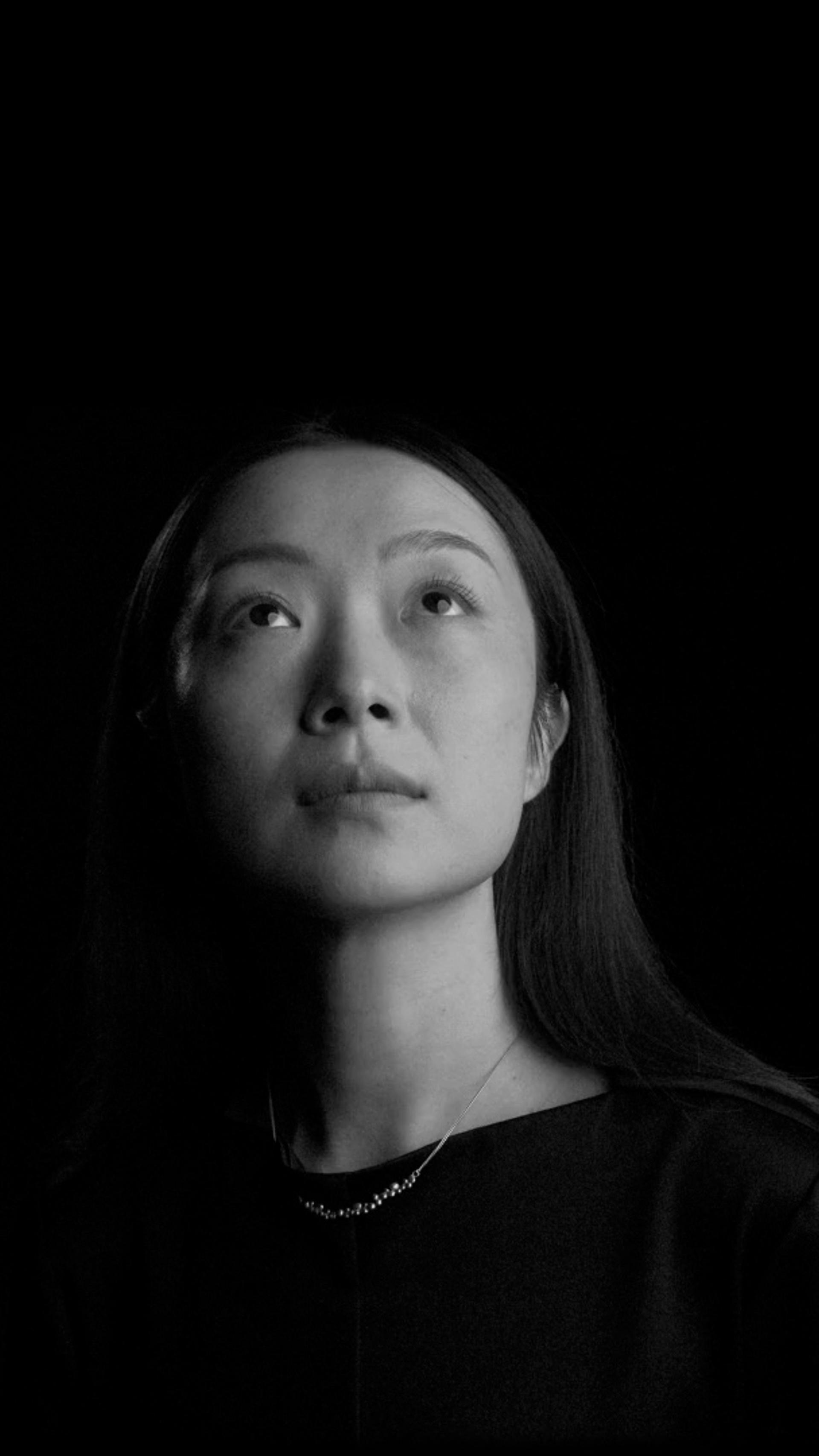 Half lit face of a woman.