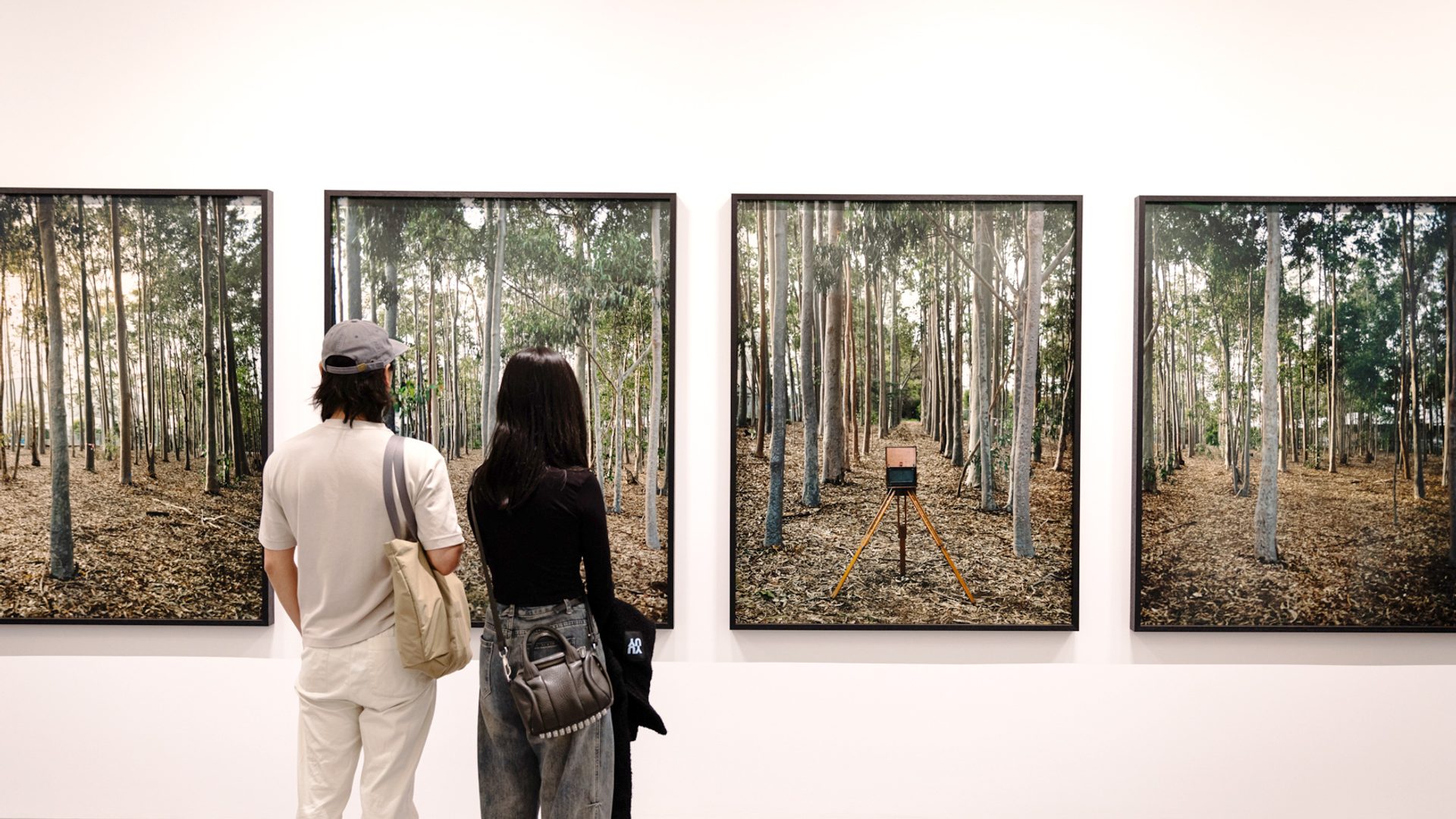 Two people looking at an artwork.