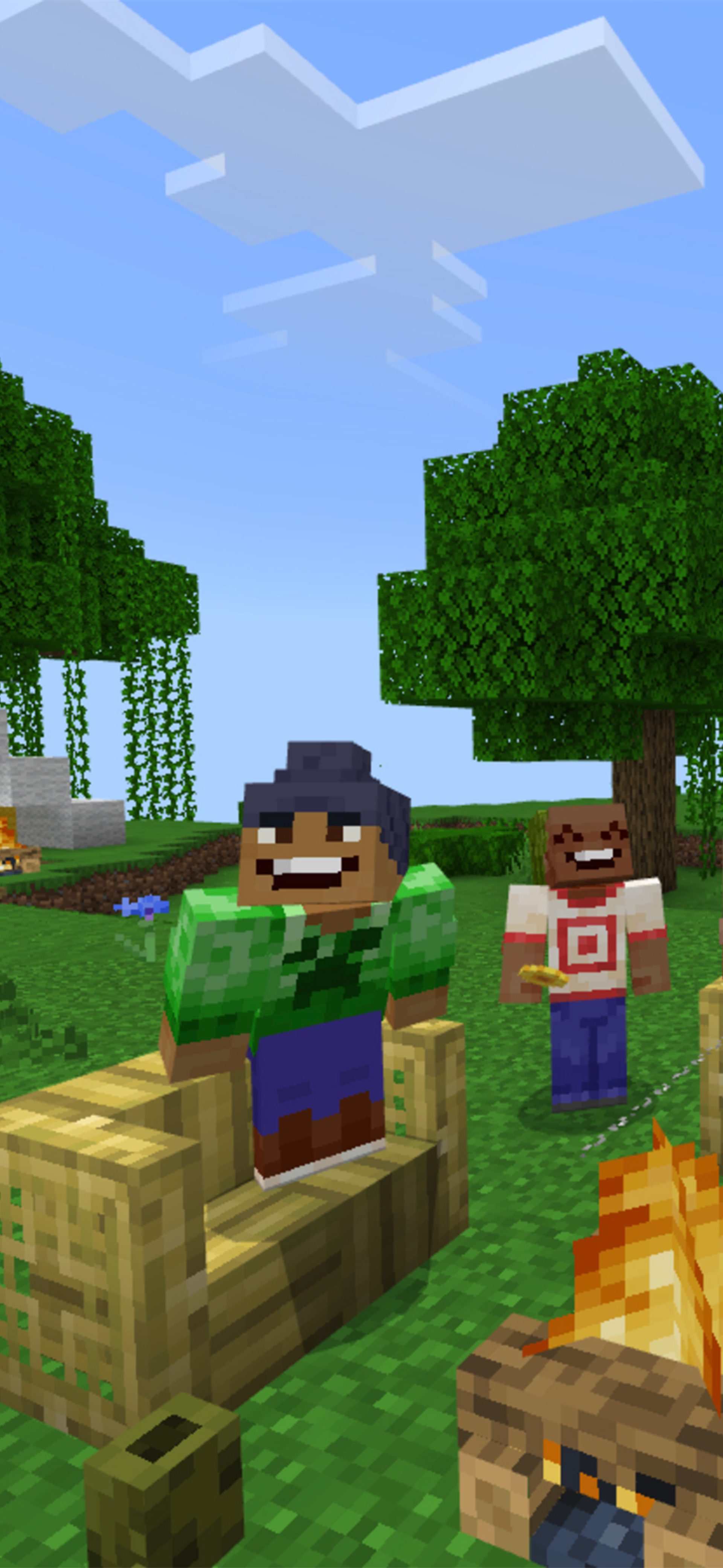 Four Minecraft characters sit around a campfire in a forest.
