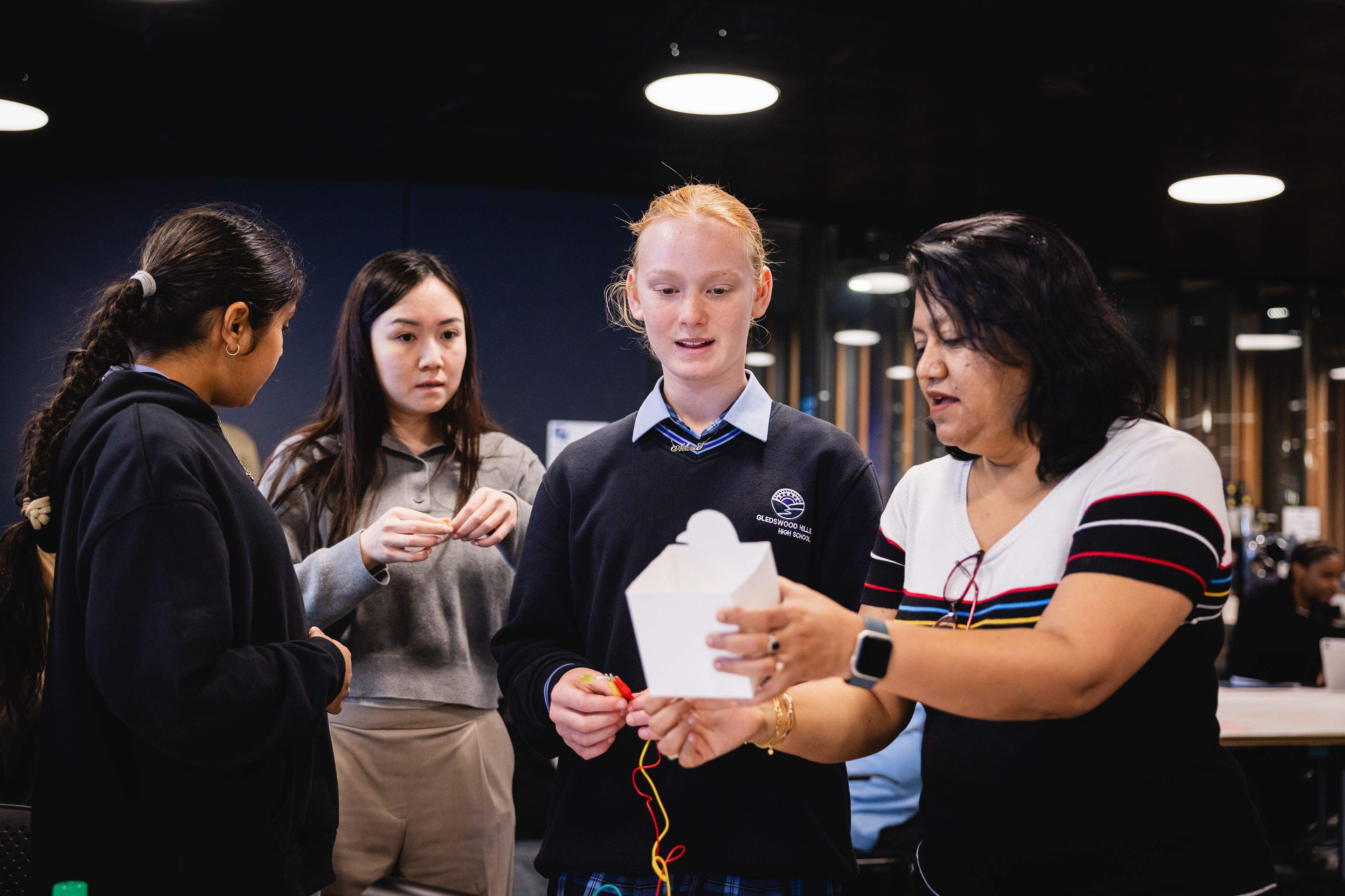Photo of teachers and students in a workshop.