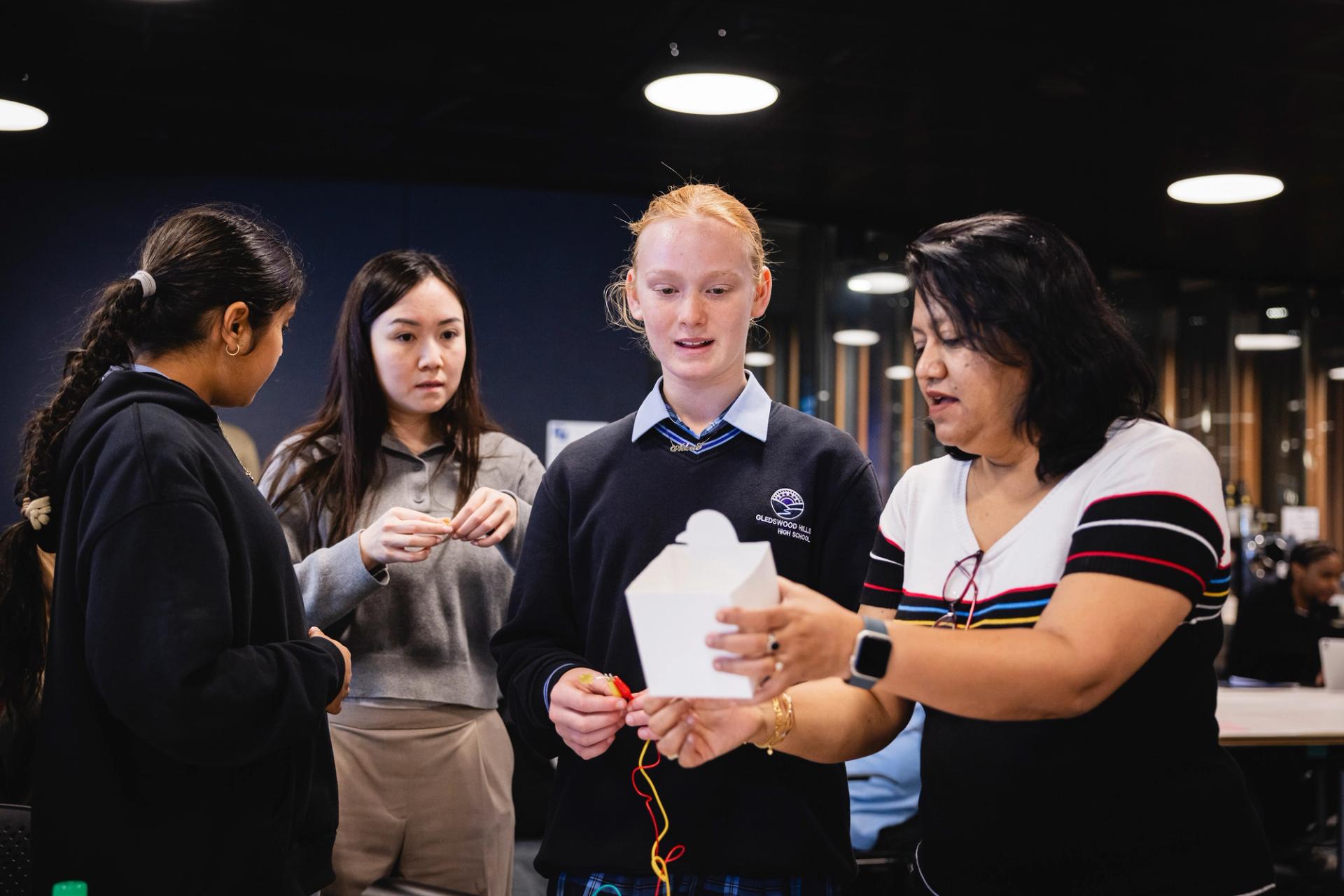 Photo of teachers and students in a workshop.
