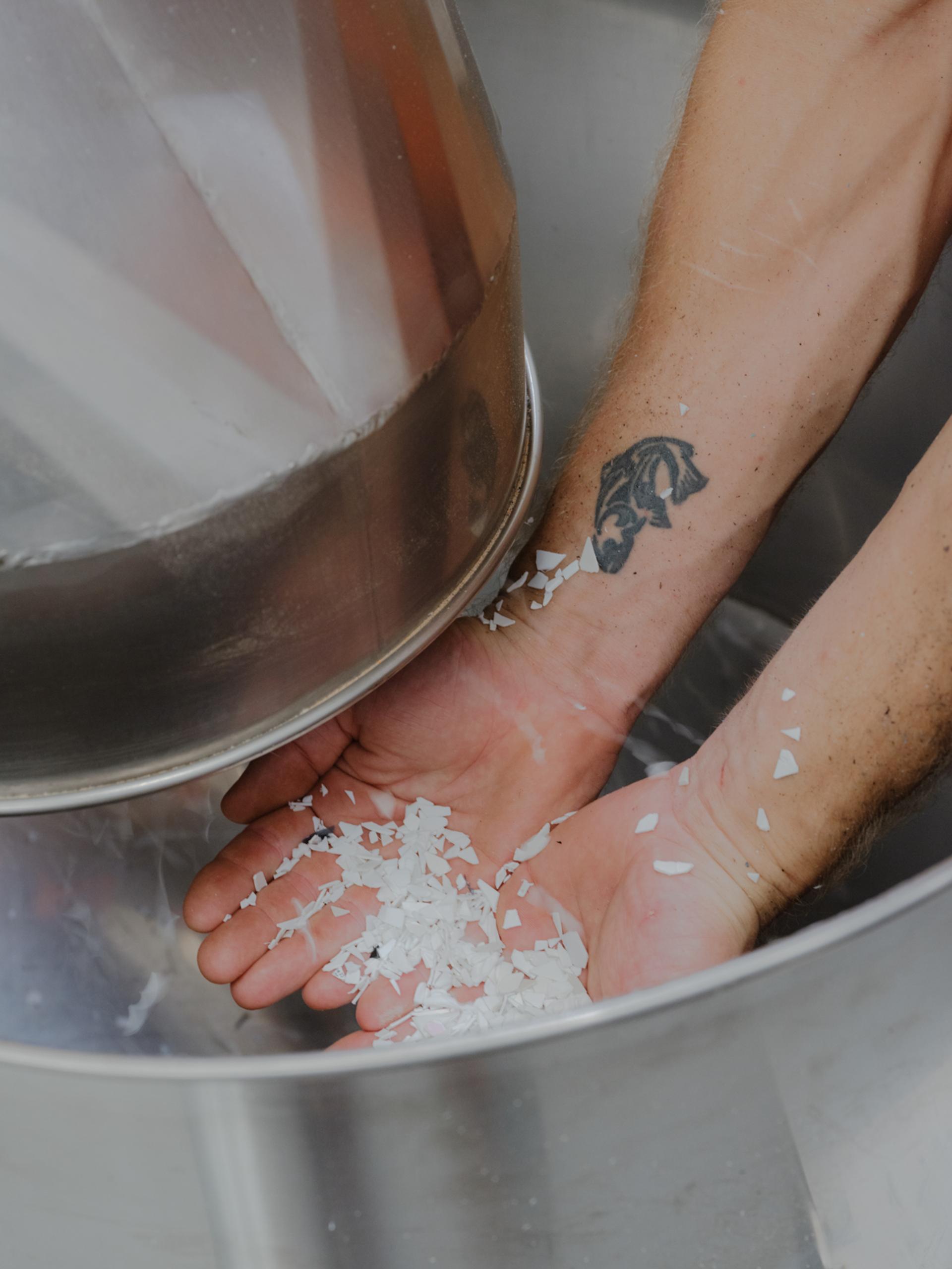 Plastic bits falls into two hands.