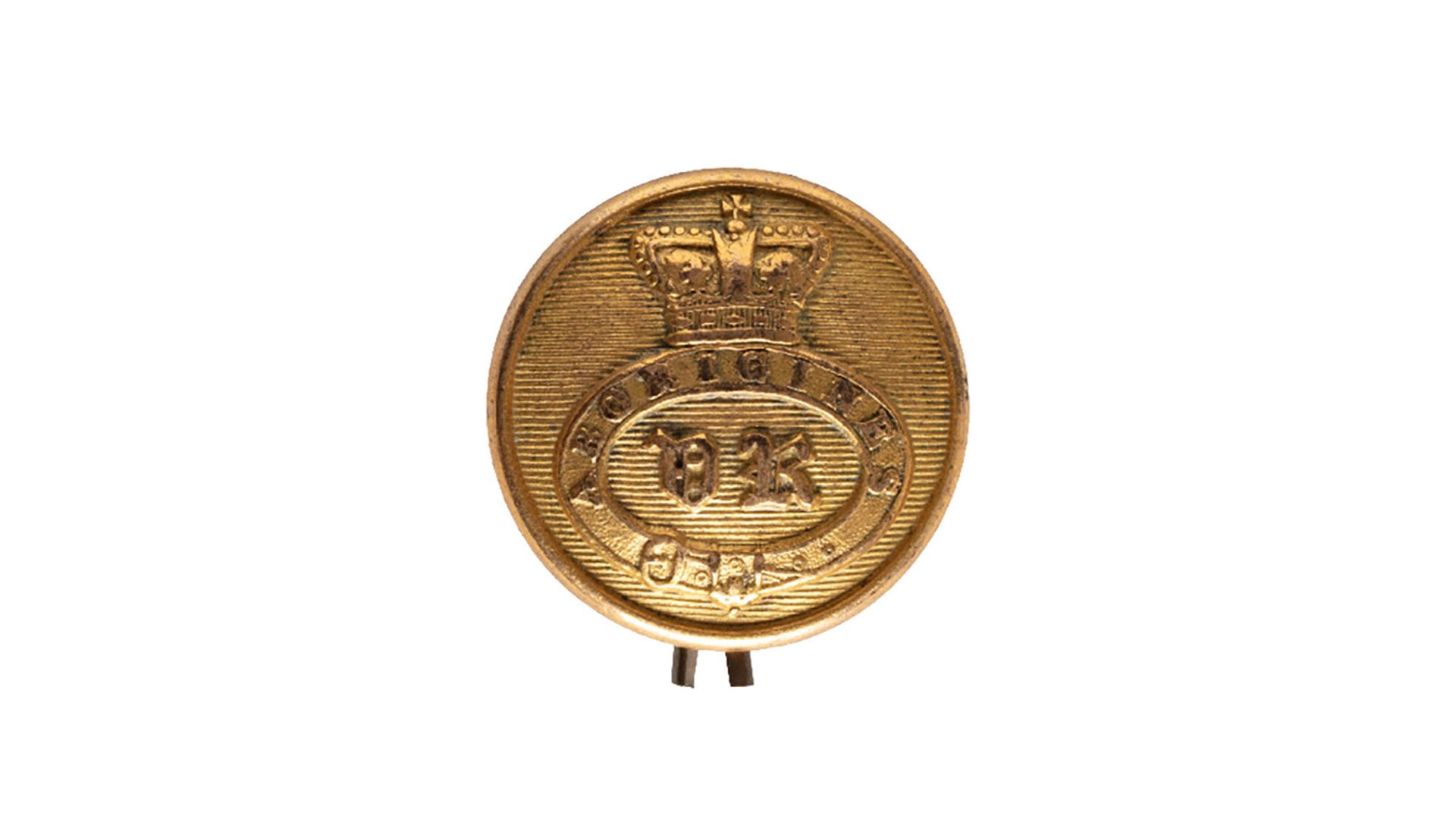 Button with concave back, consisting of a garter band with the inscription "ABORIGINES/ VR" within, surmounted by a crown. The reverse of the button, has a loop for attachment and is inscribed "NEW HOLLAND" Ex Sir John Ferguson & L. Barton collections.