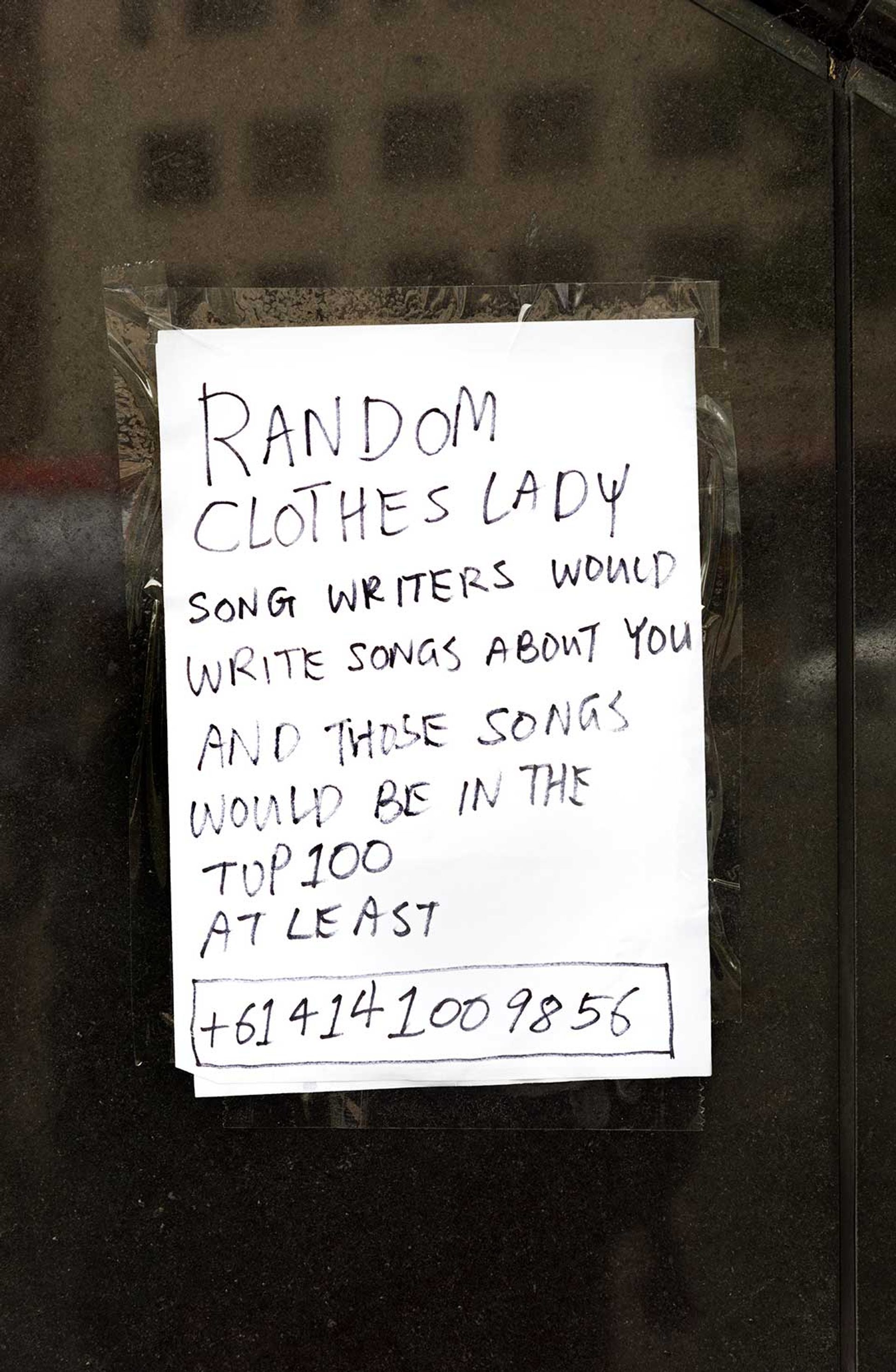 Note reading “RANDOM CLOTHES LADY SONG WRITERS WOULD WRITE SONGS ABOUT YOU AND THOSE SONGS WOULD BE IN THE TOP 100 AT LEAST”