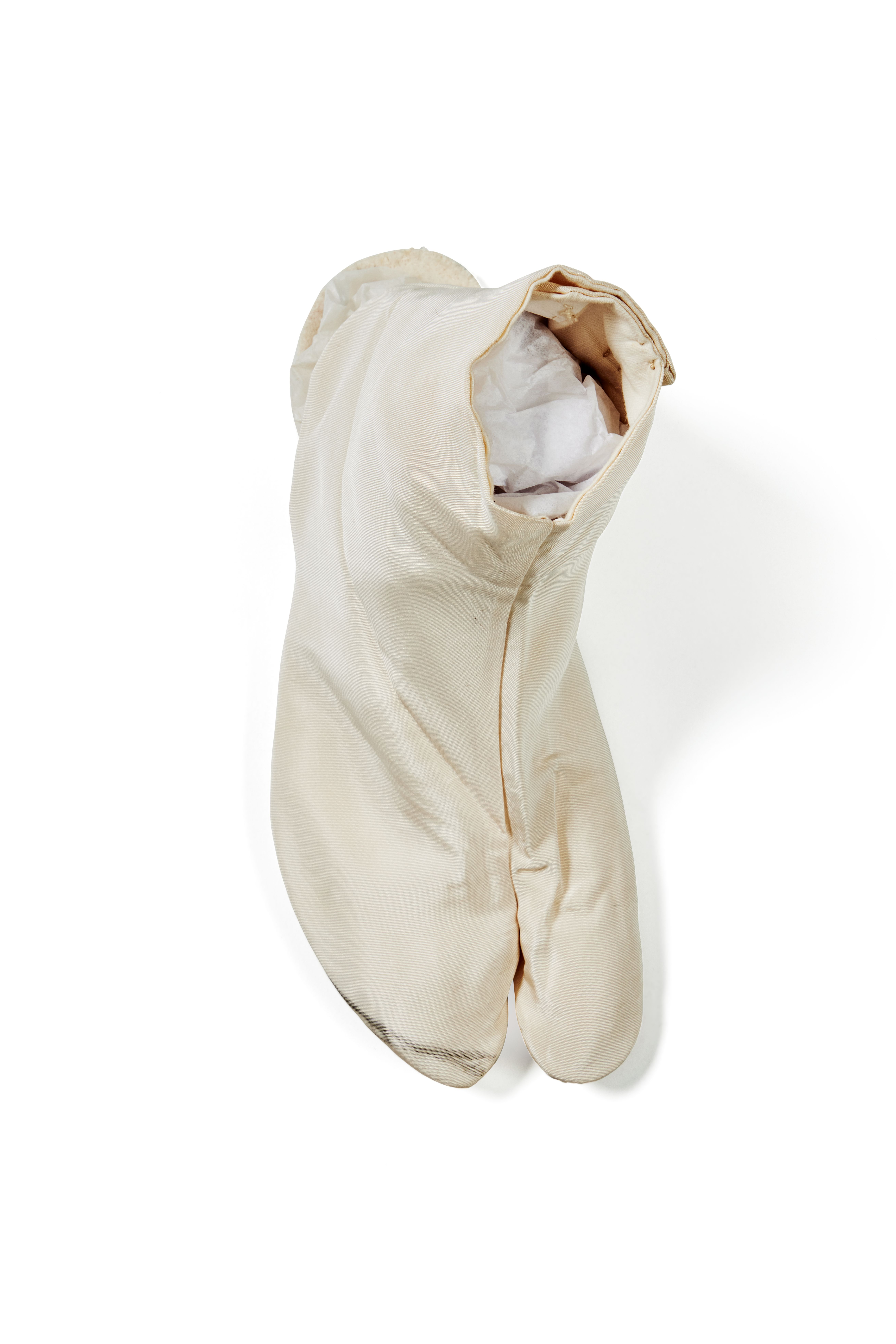 White tabi (right of pair) sock with a split at the toes made of silk, cotton and metal.