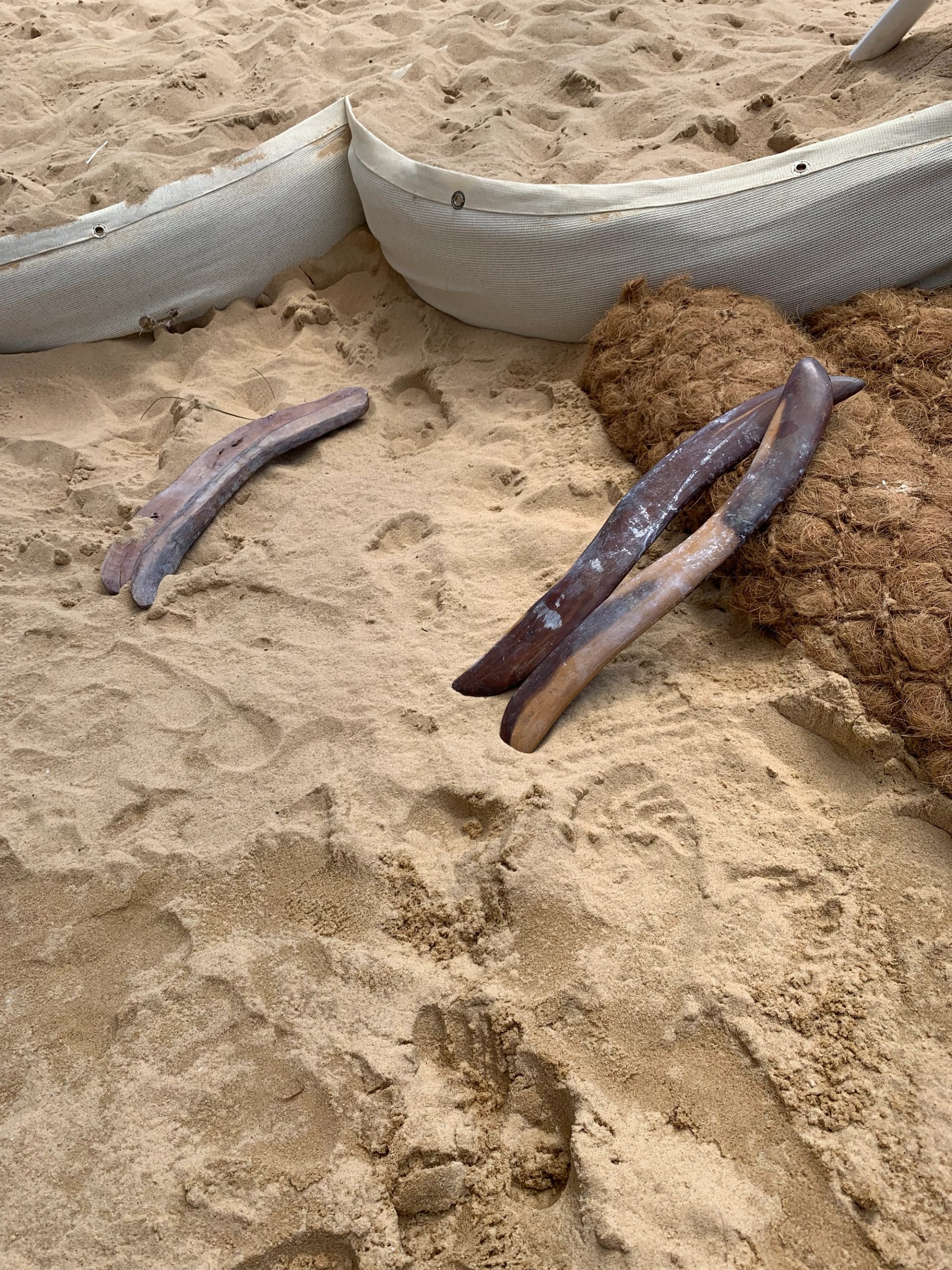 sand with stick and barricades within it