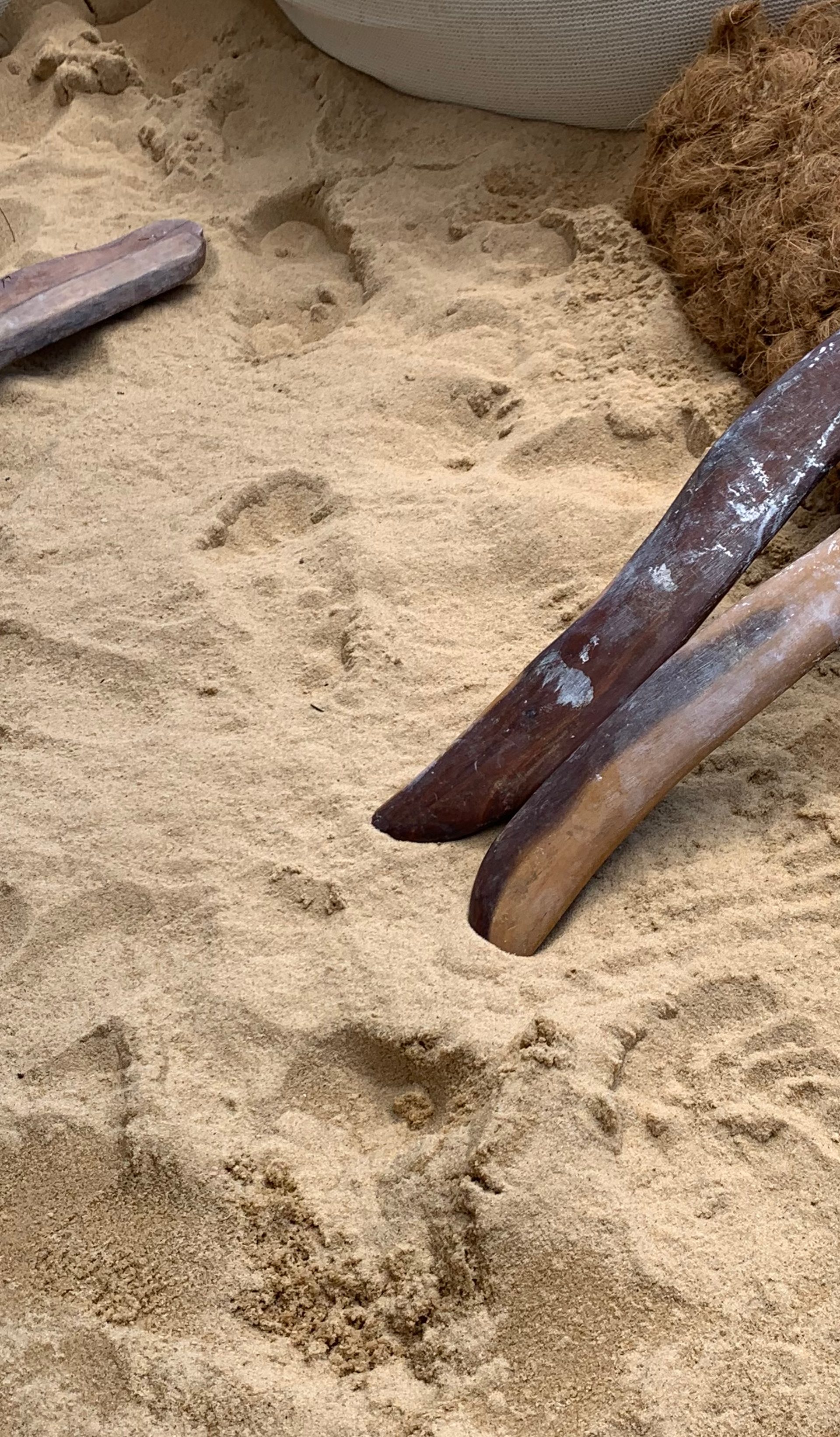 sand with stick and barricades within it