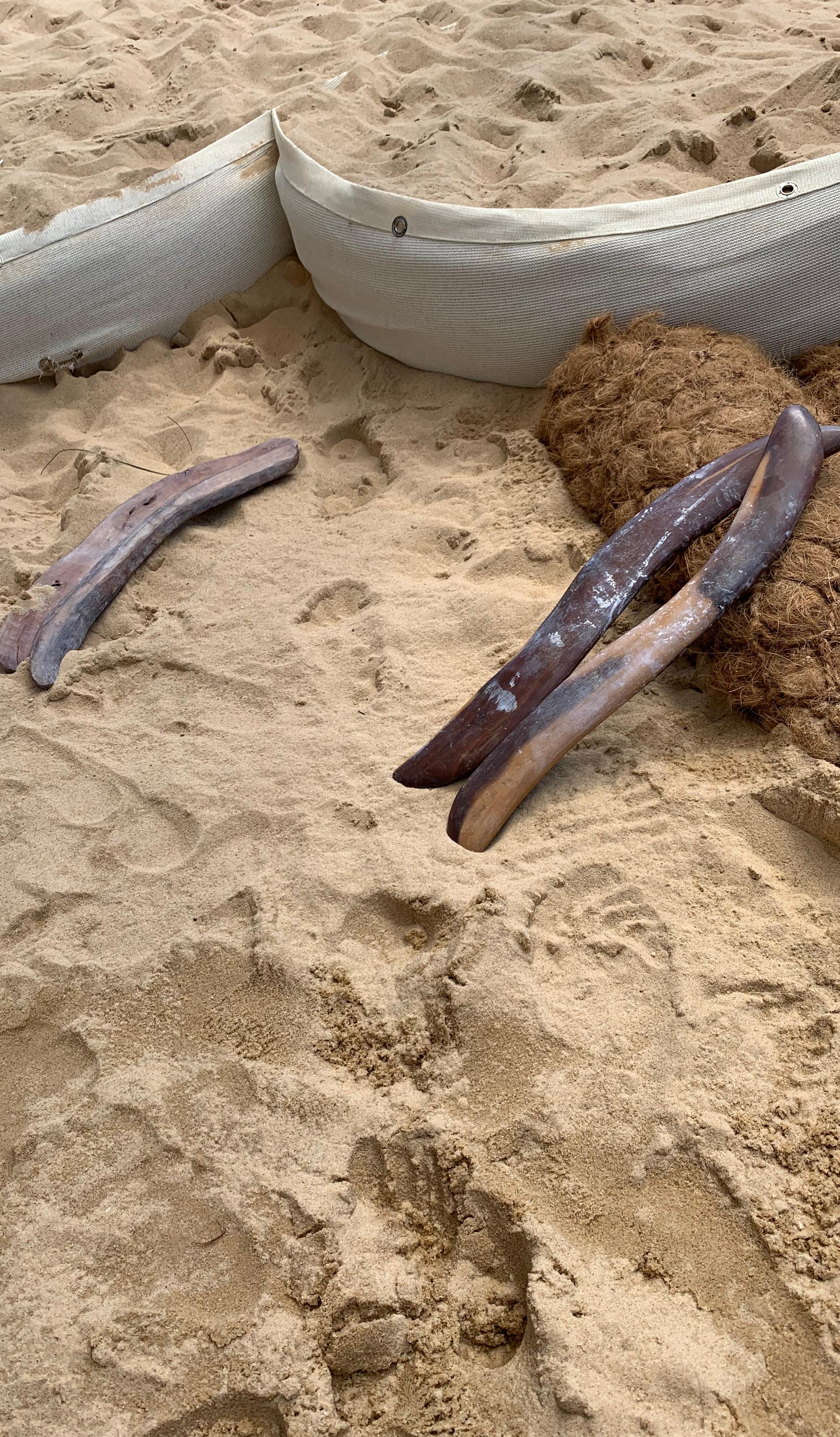 sand with stick and barricades within it
