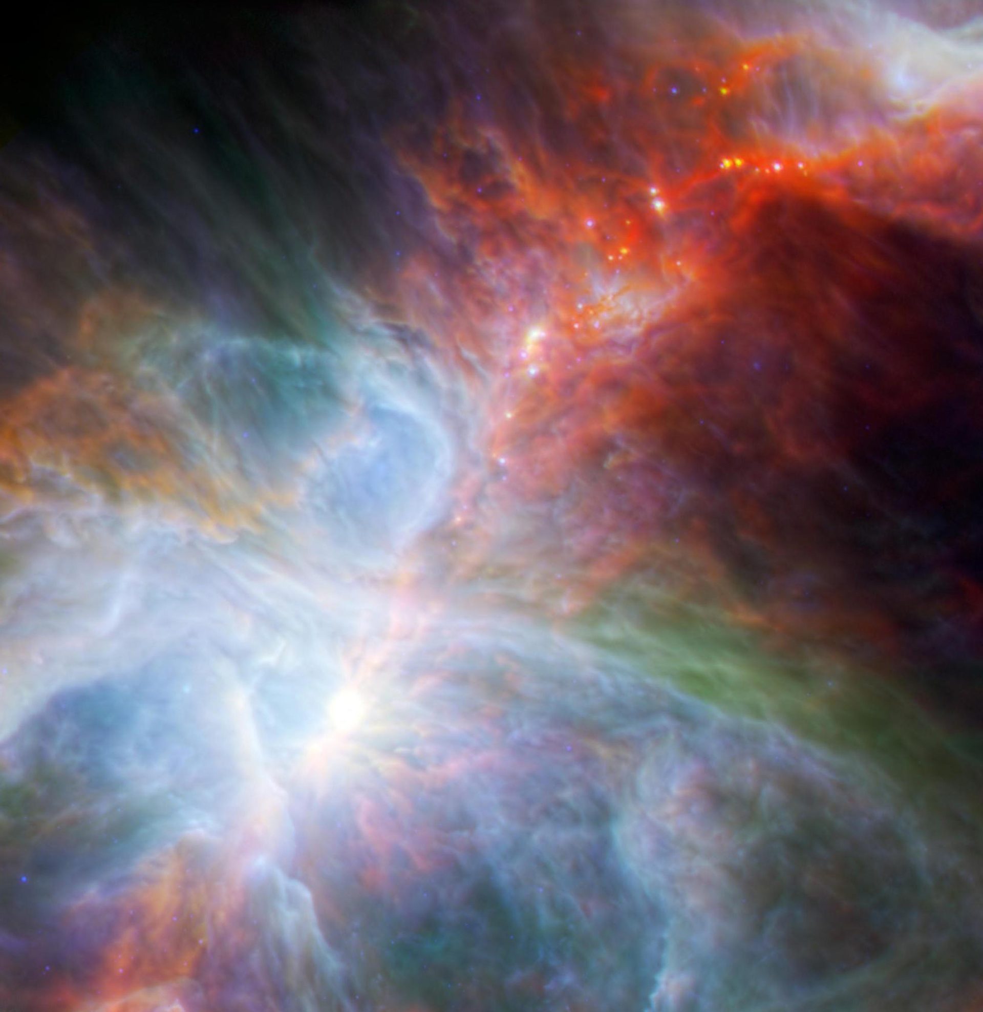 Colour highlights fledgling stars hidden in the gas and clouds.