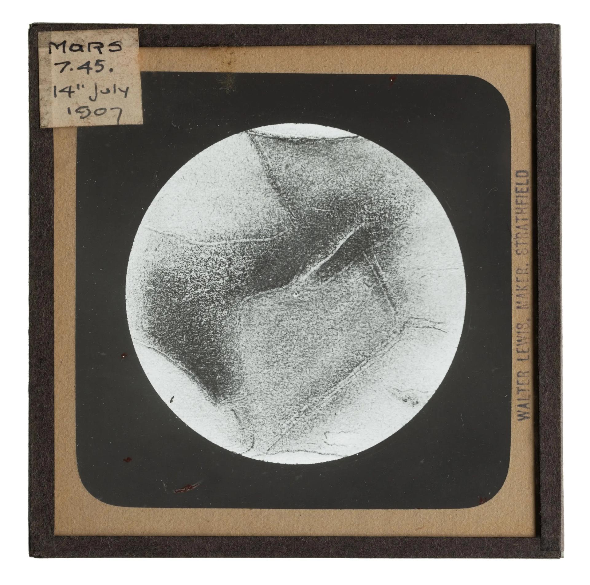 Photograph of a lantern slide featuring Mars, part of a collection