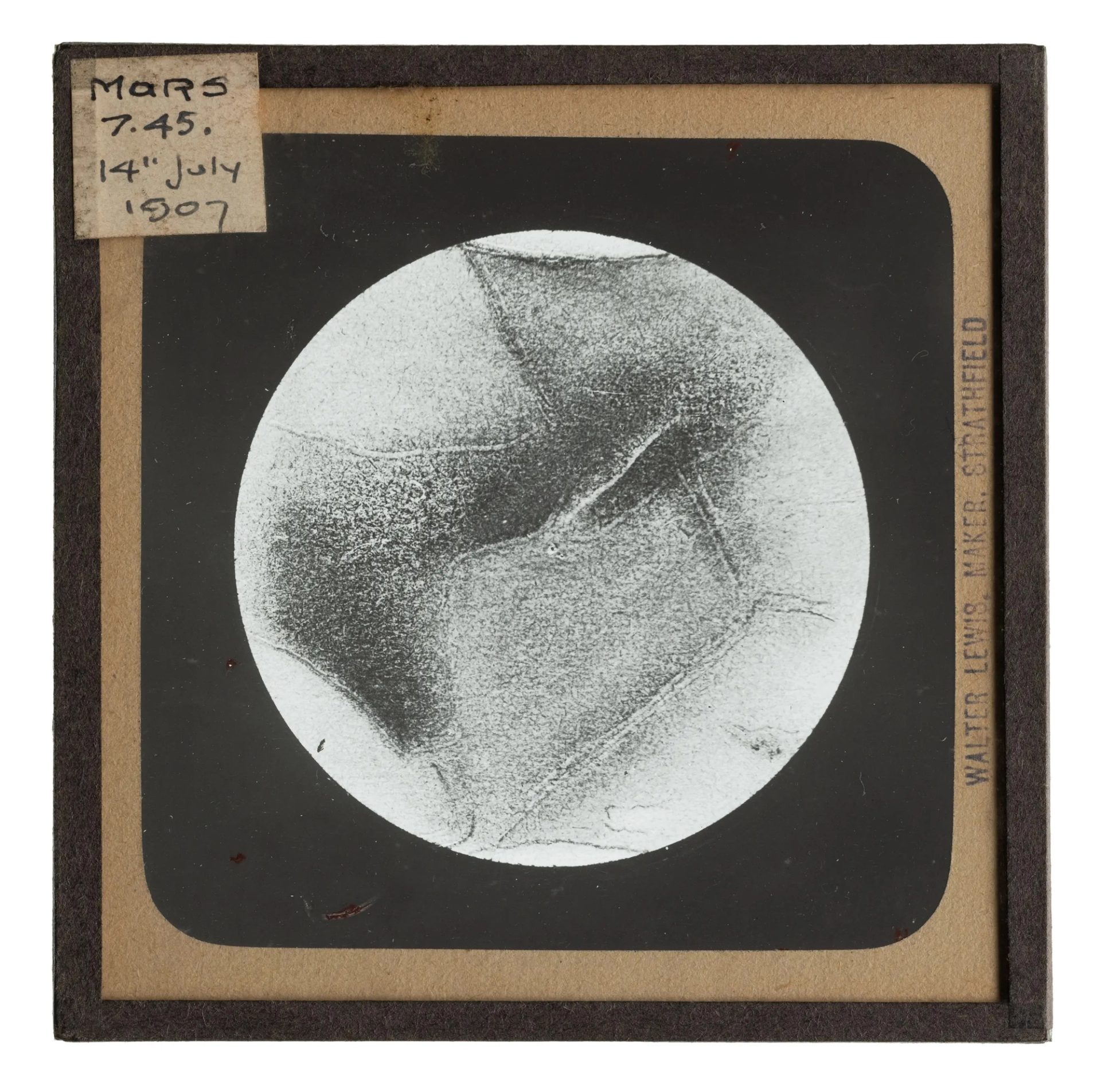 Photograph of a lantern slide featuring Mars, part of a collection