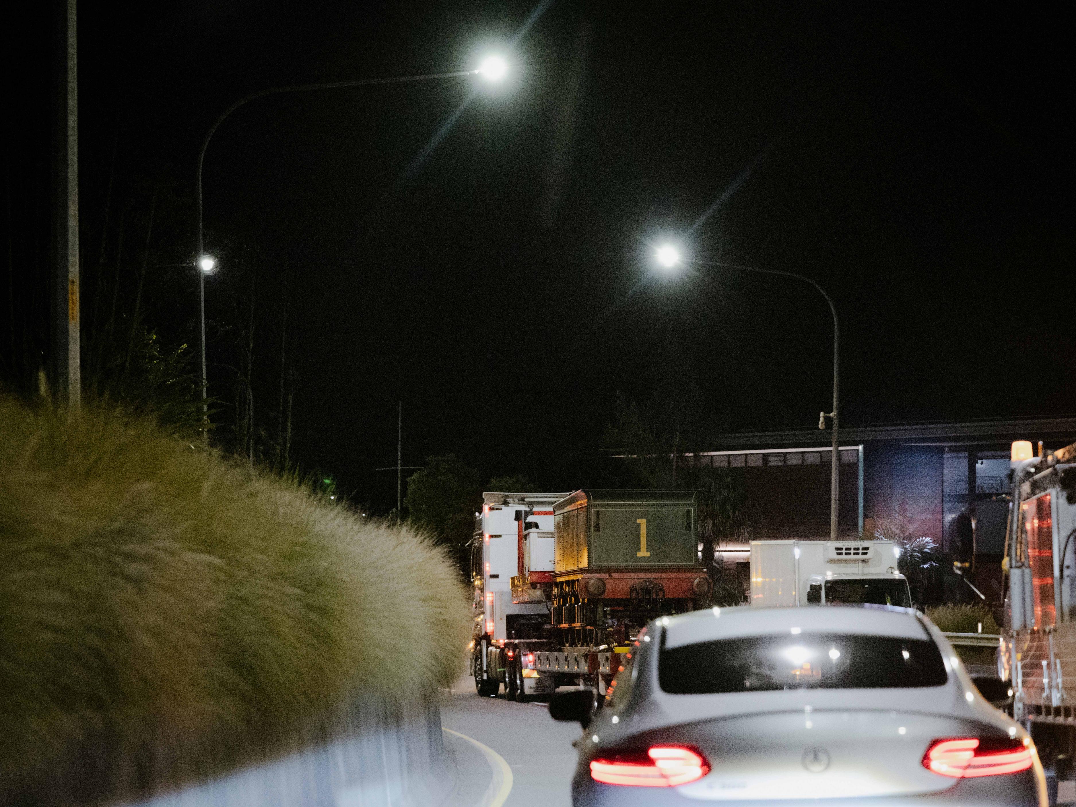 Looking ahead of traffic at a train on a truck.