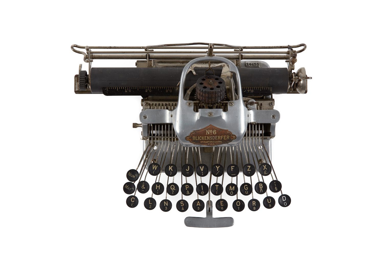 Typewriter with metal exterior and black keys.