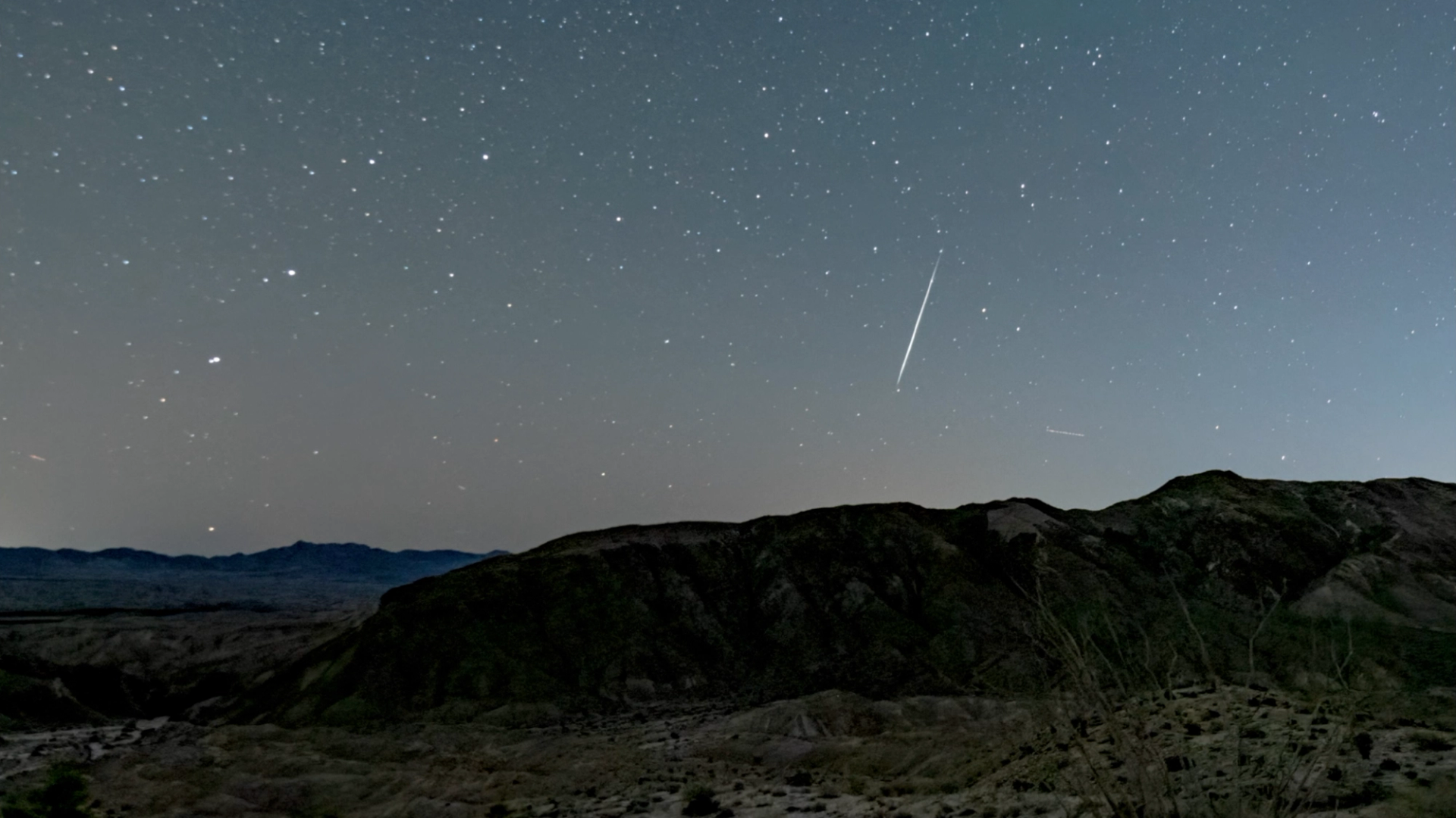 A photograph catching the Eta Aquariid Meteor Shower outside against the sunset sky.