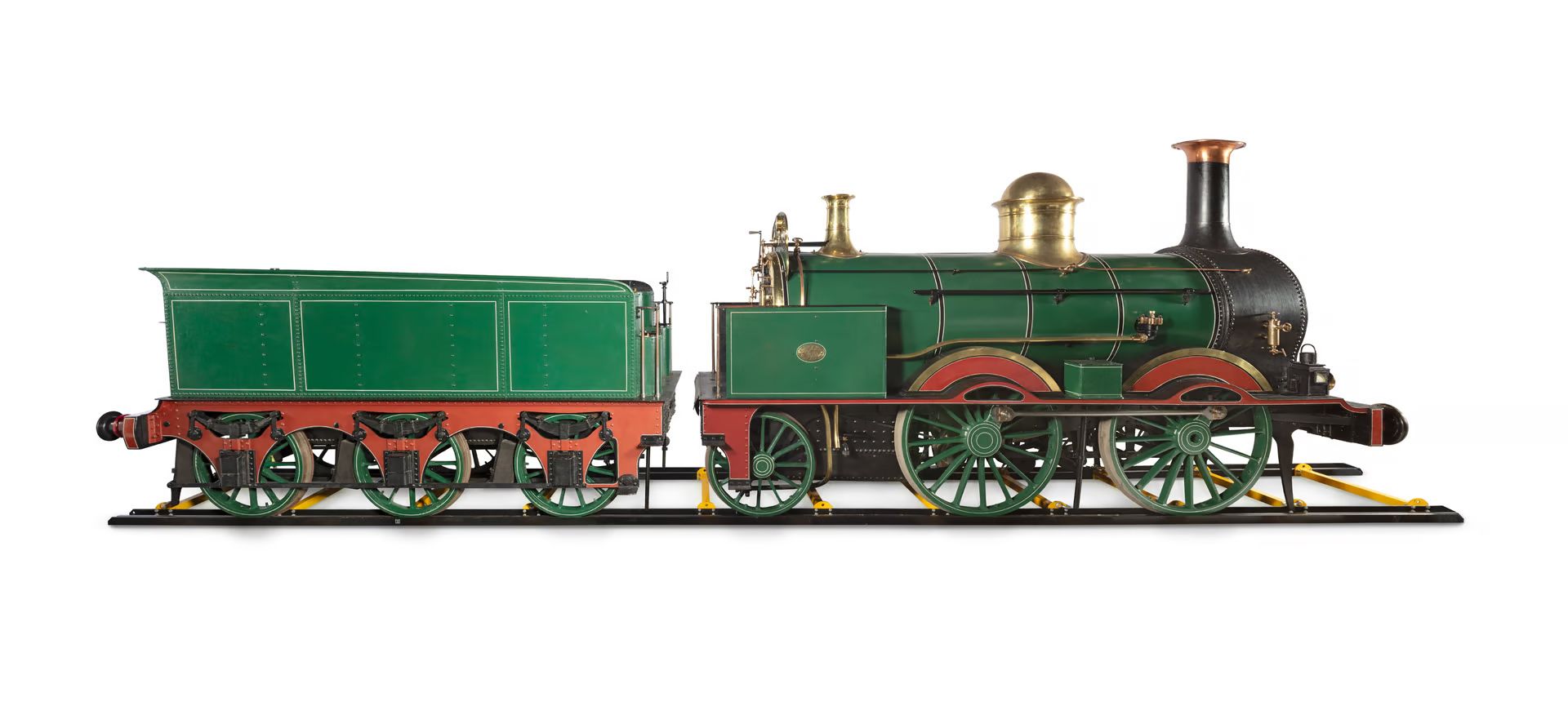 Steam train and coal carriage from the side.