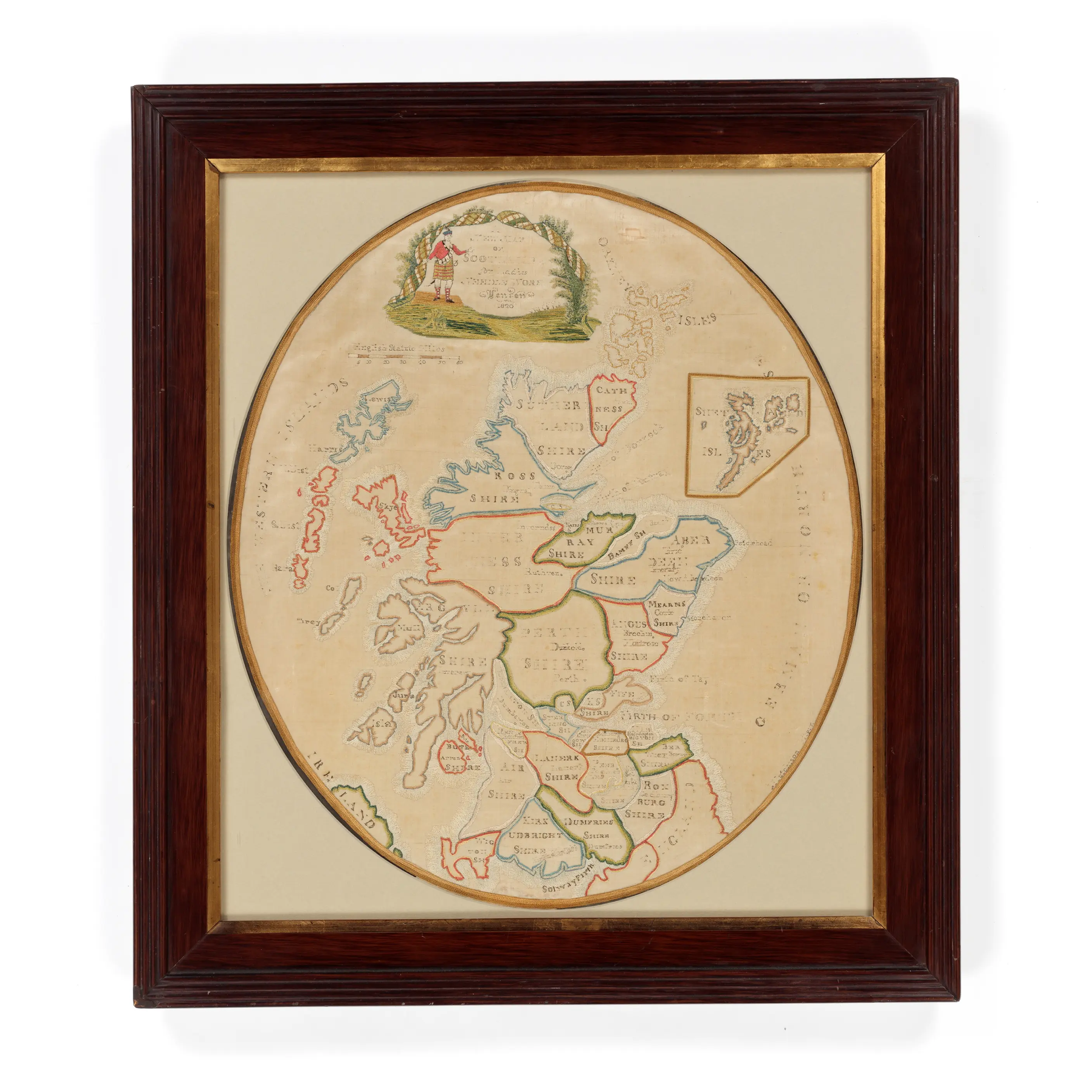 A brown and gold framed map of Scotland using embroidery.
