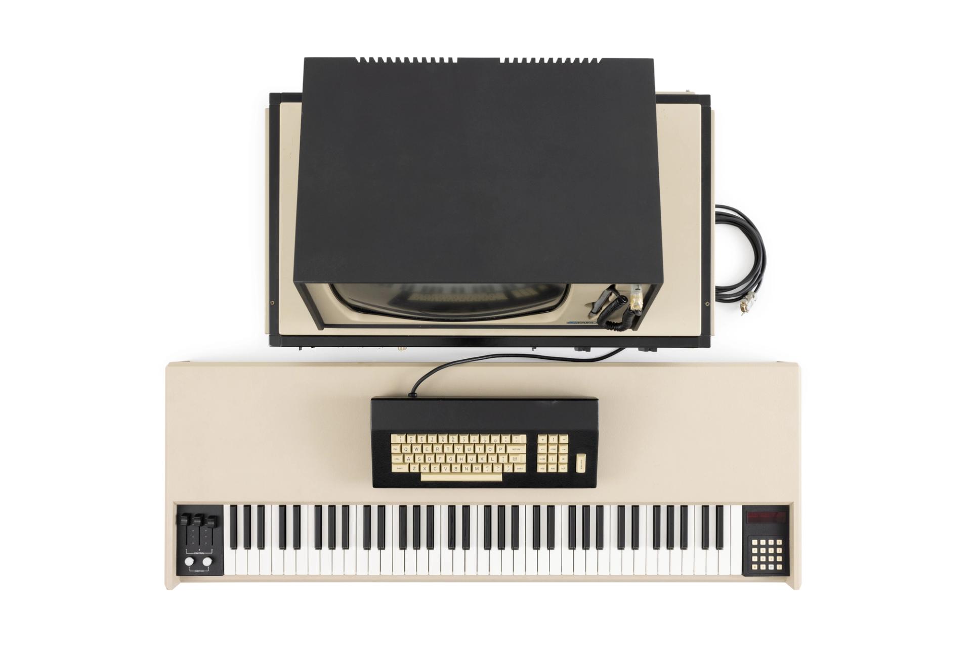 The Fairlight CMI (Computer Musical Instrument) consists of a central processing unit, a video monitor with attached light-pen, a computer keyboard and a music keyboard. Accessories for the instrument include the floppy disks used to store data, power cords and manuals.