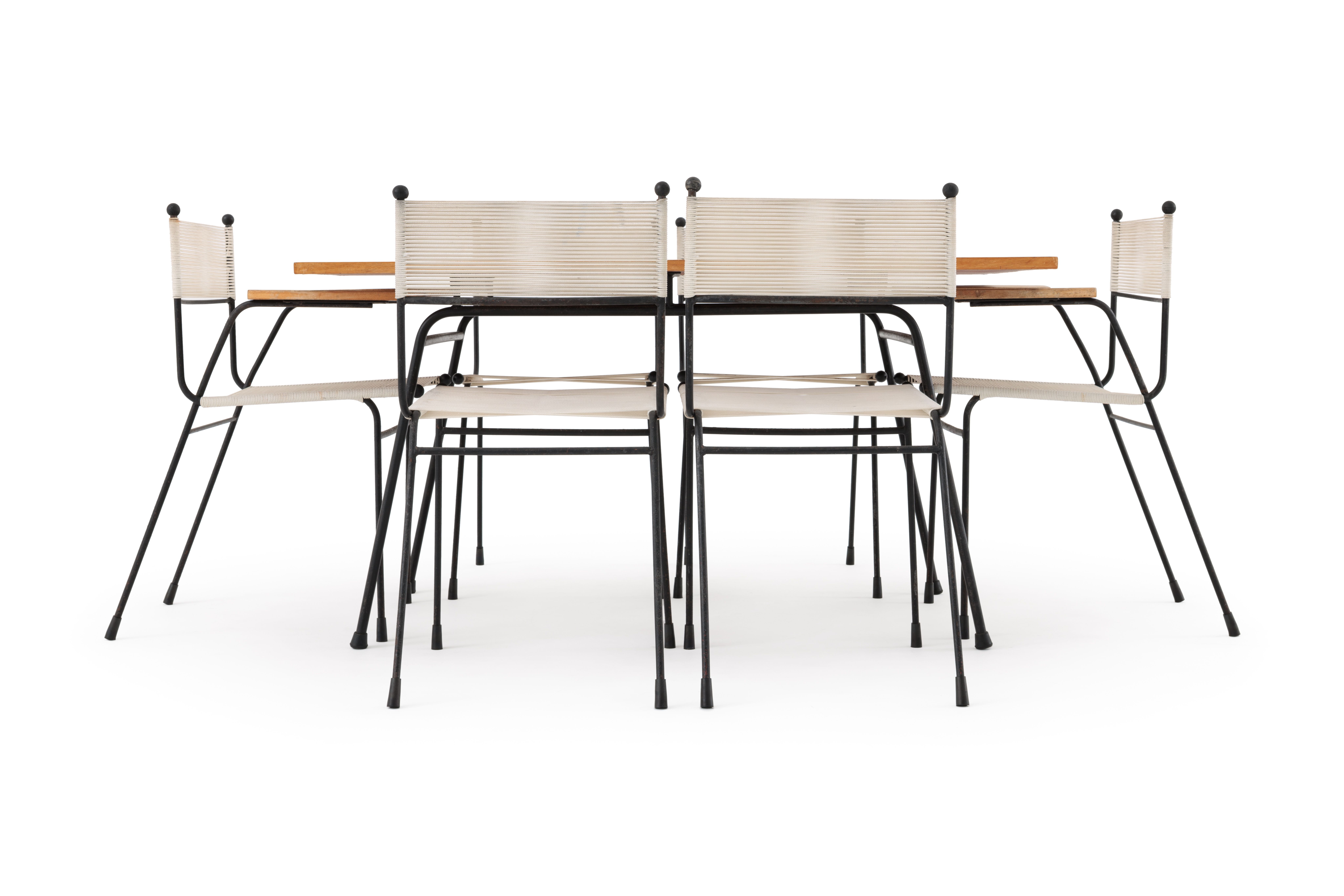 Dining table with four dining chairs and two carvers.