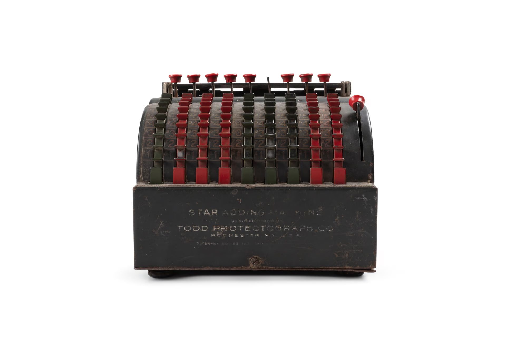 black mechanical machine with red and black buttons.