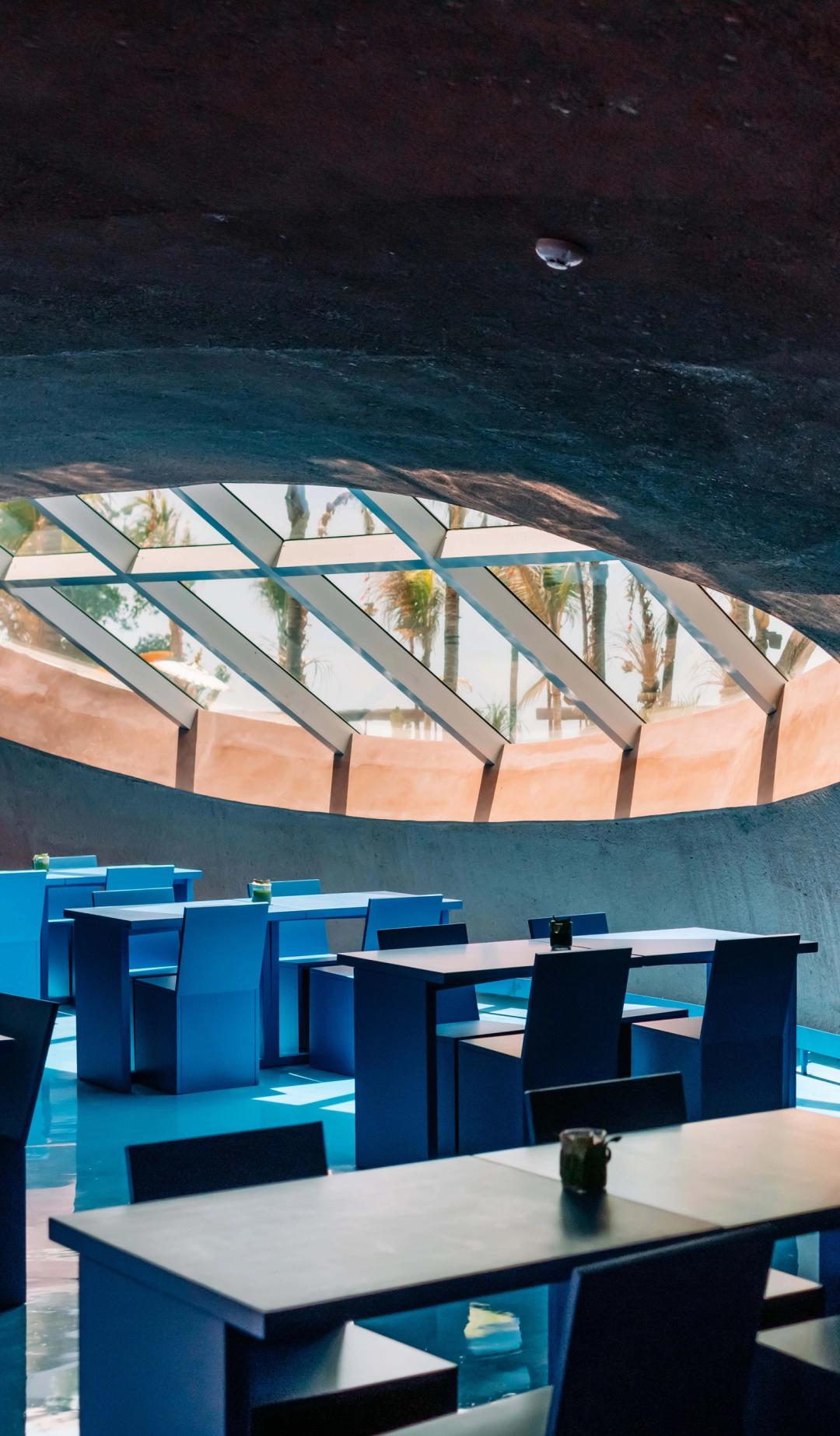 An interior space with a circular ceiling window.