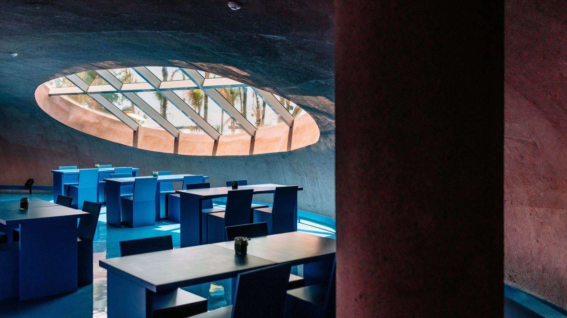 An interior space with a circular ceiling window.