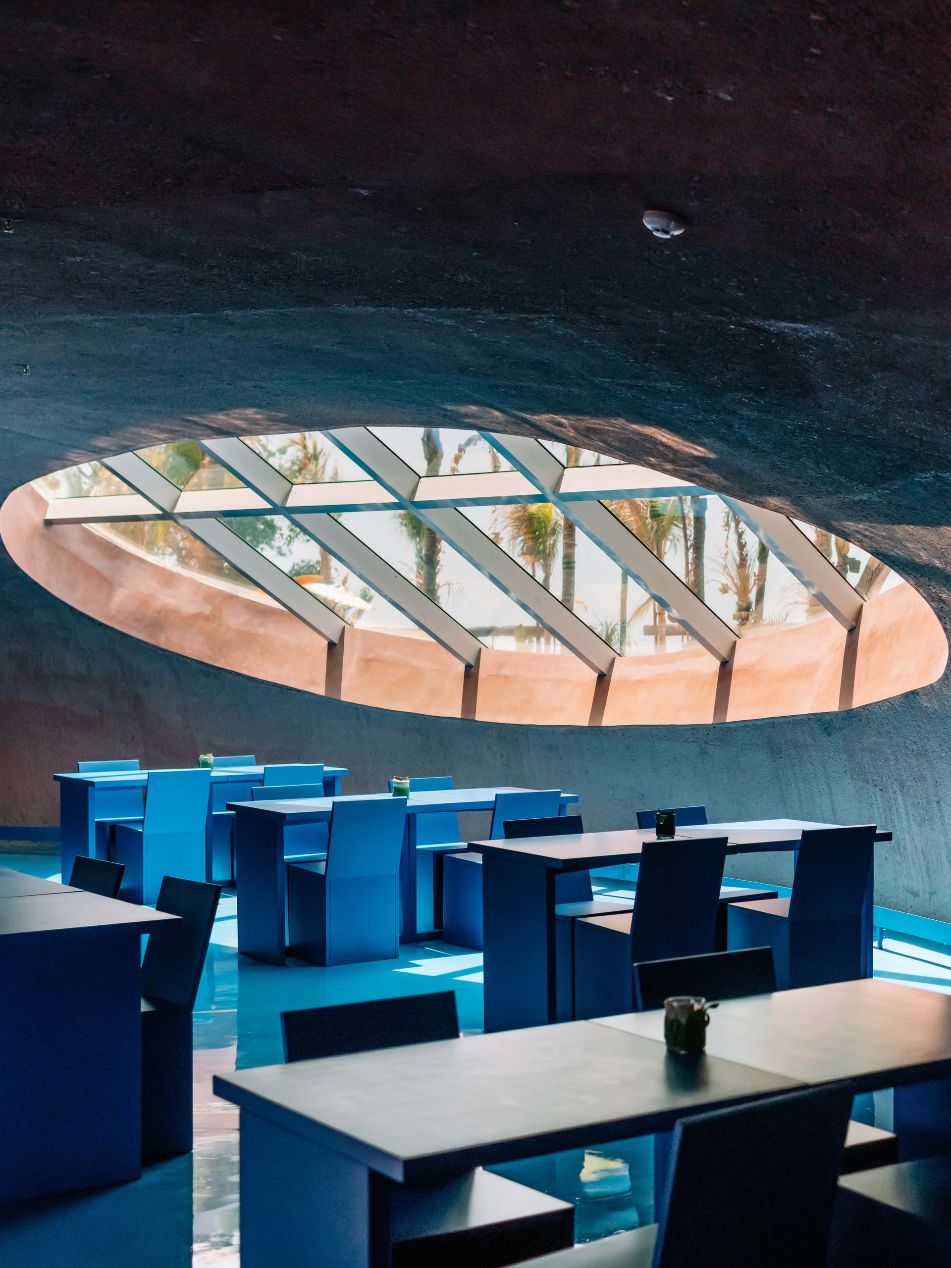 An interior space with a circular ceiling window.