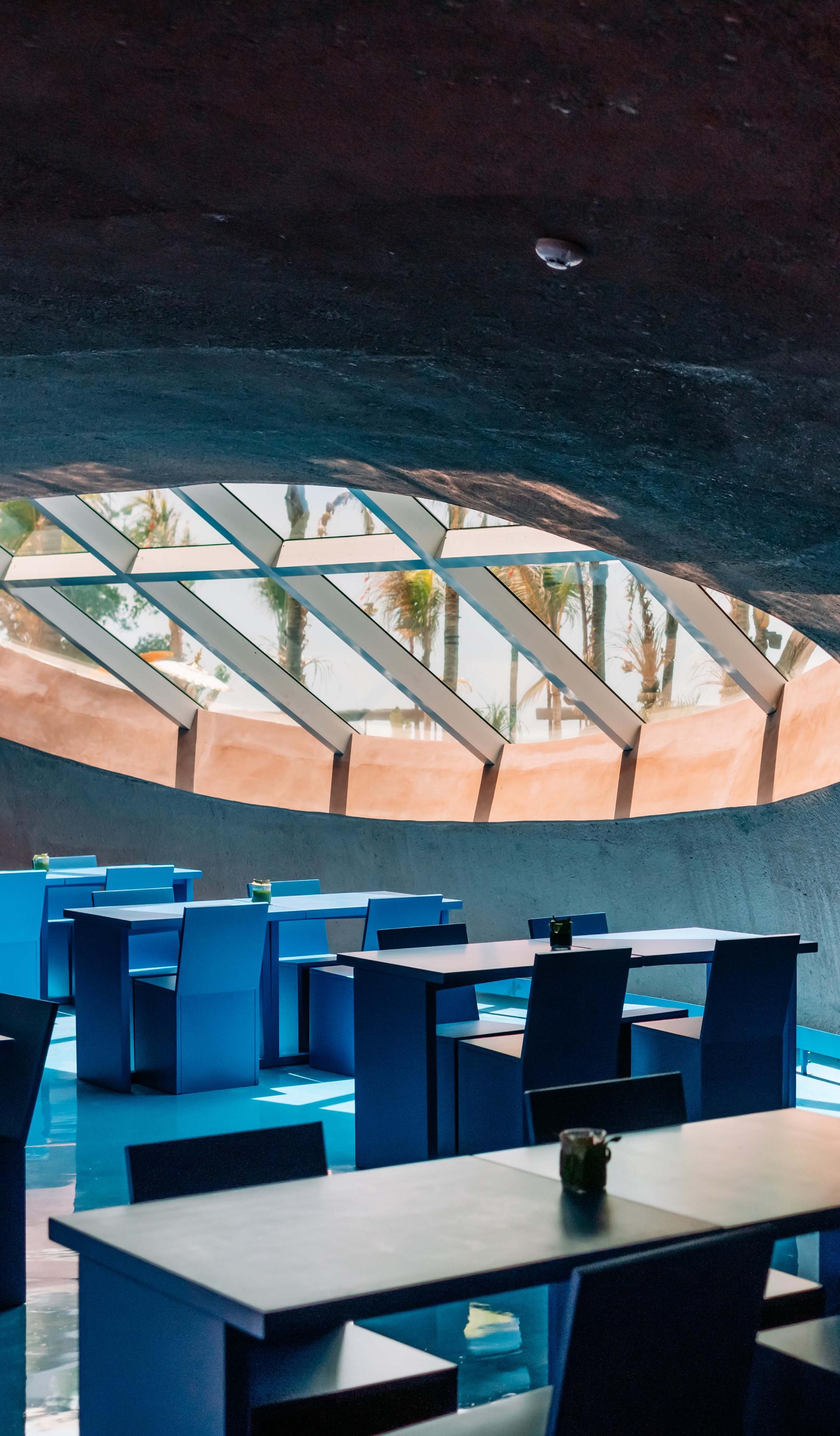 An interior space with a circular ceiling window.