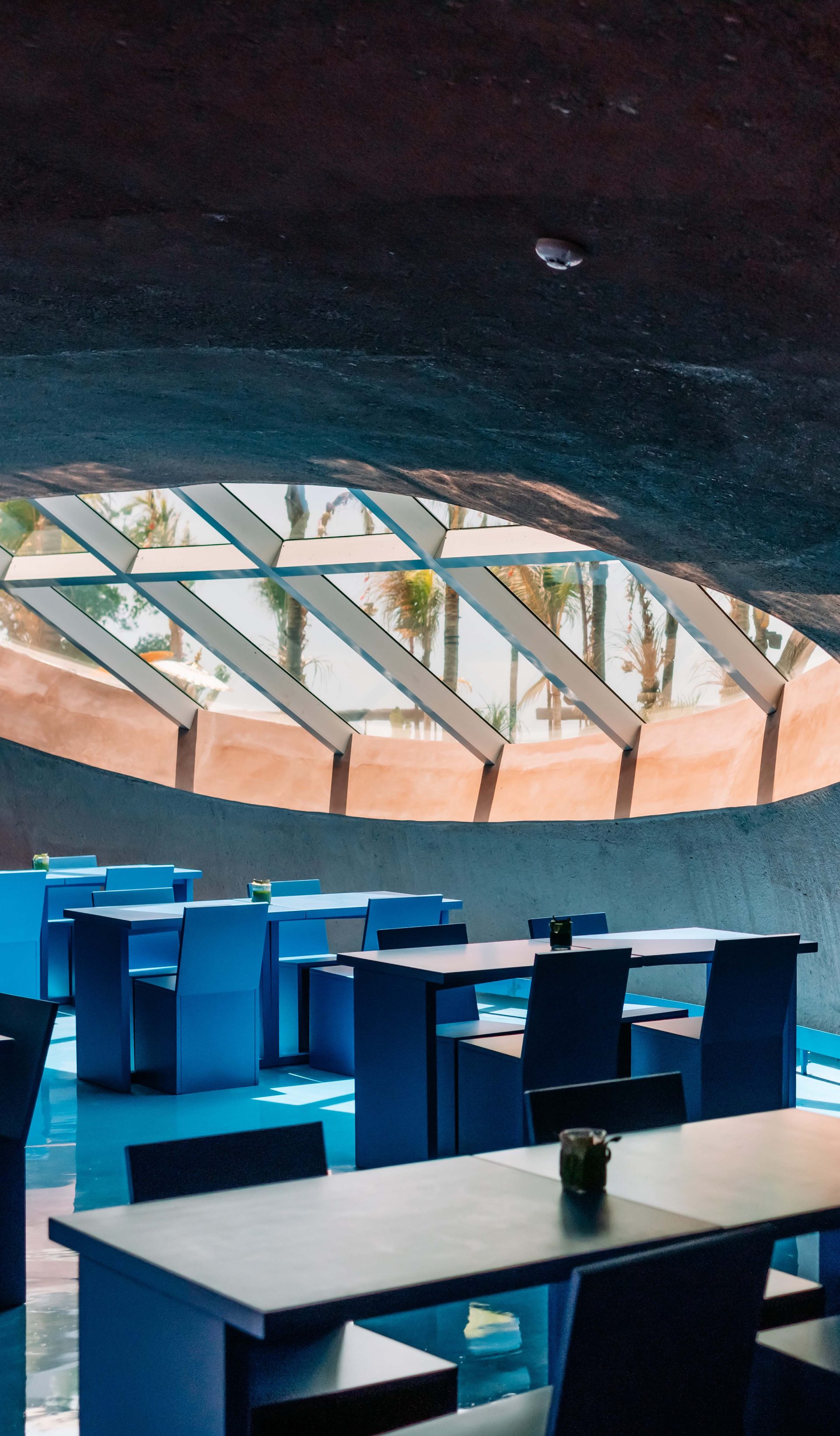 An interior space with a circular ceiling window.