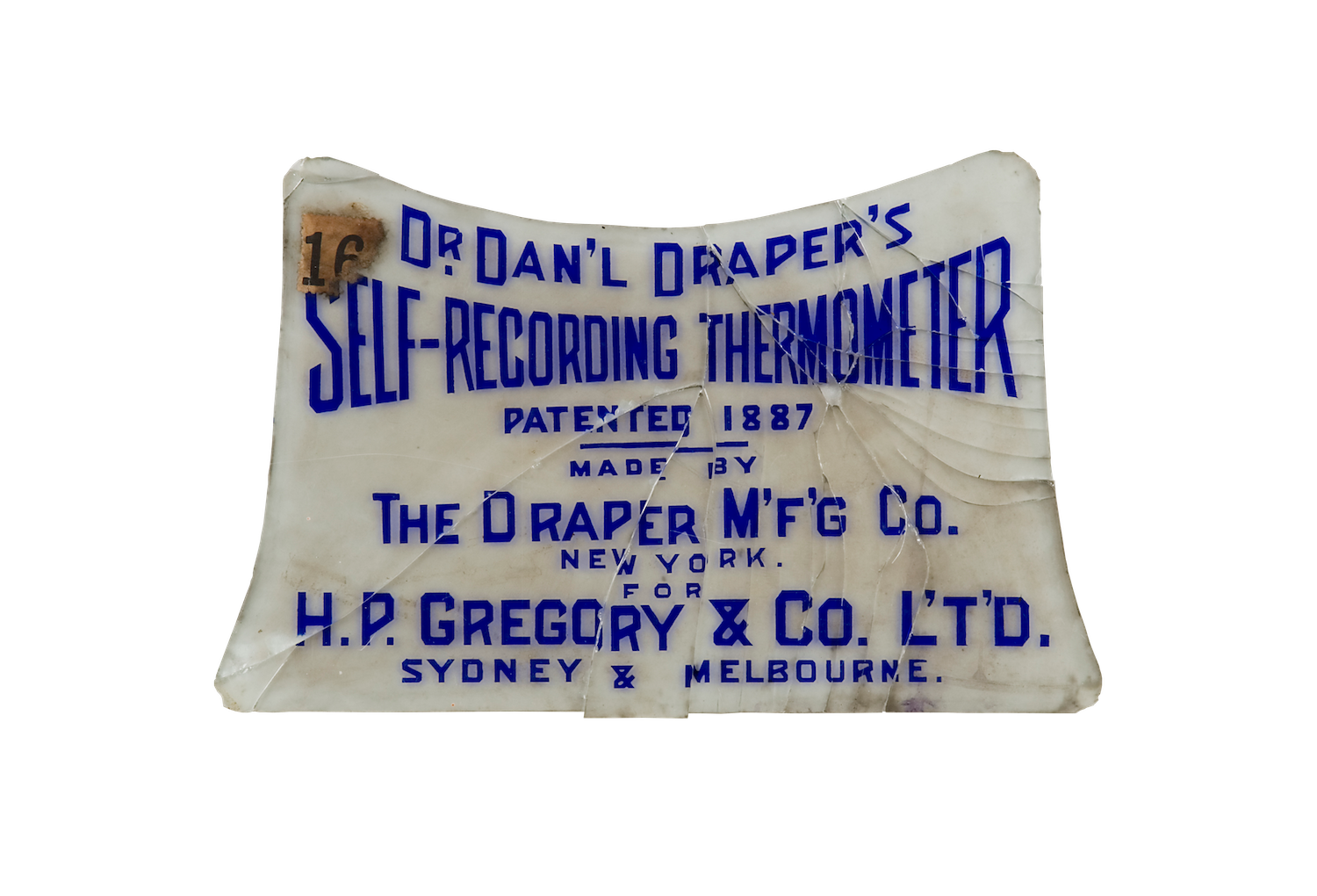 A smashed glass plaque with curved edges and blue lettering.