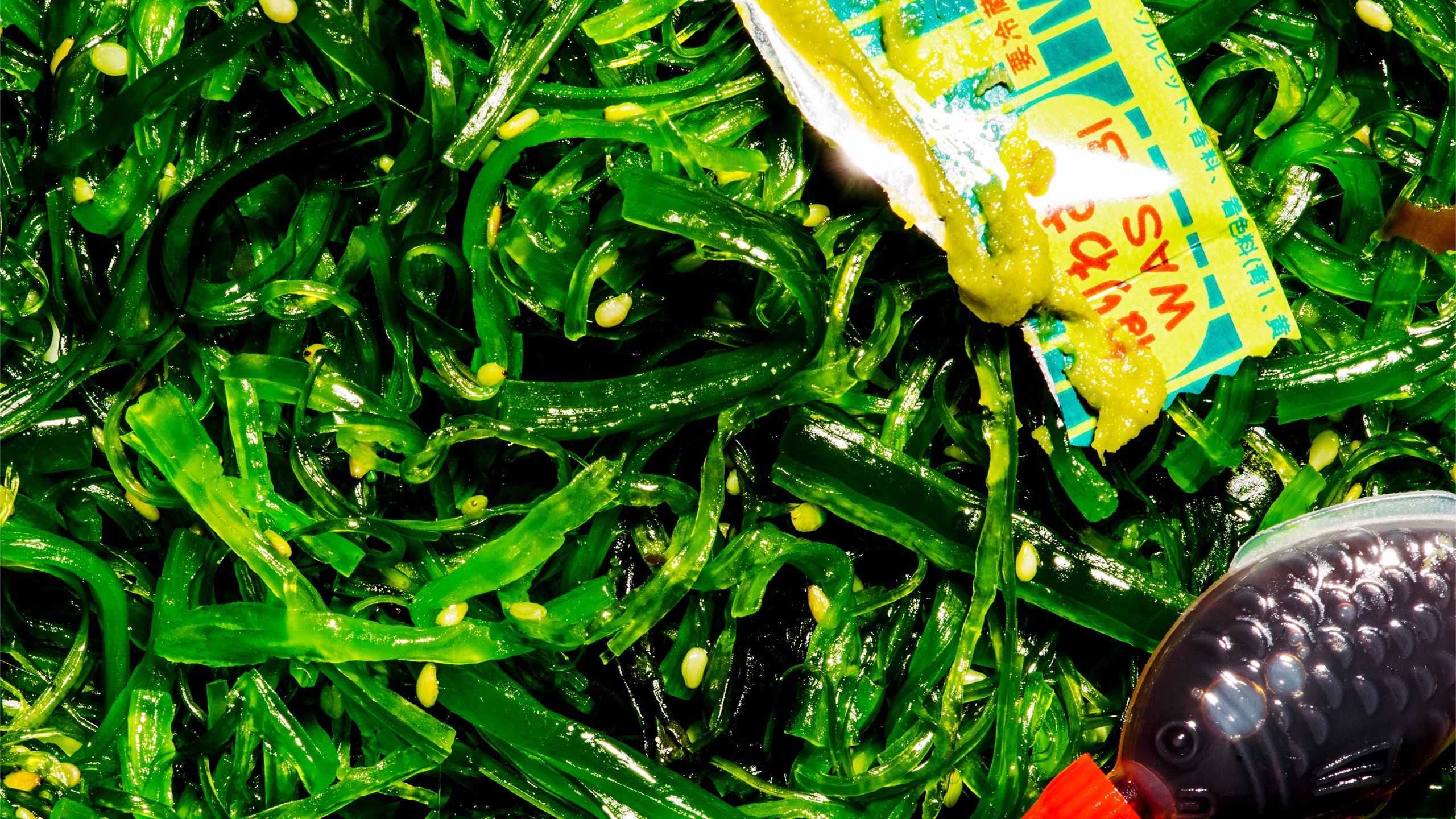 Seaweed, wasabi packet and soy sauce fish.