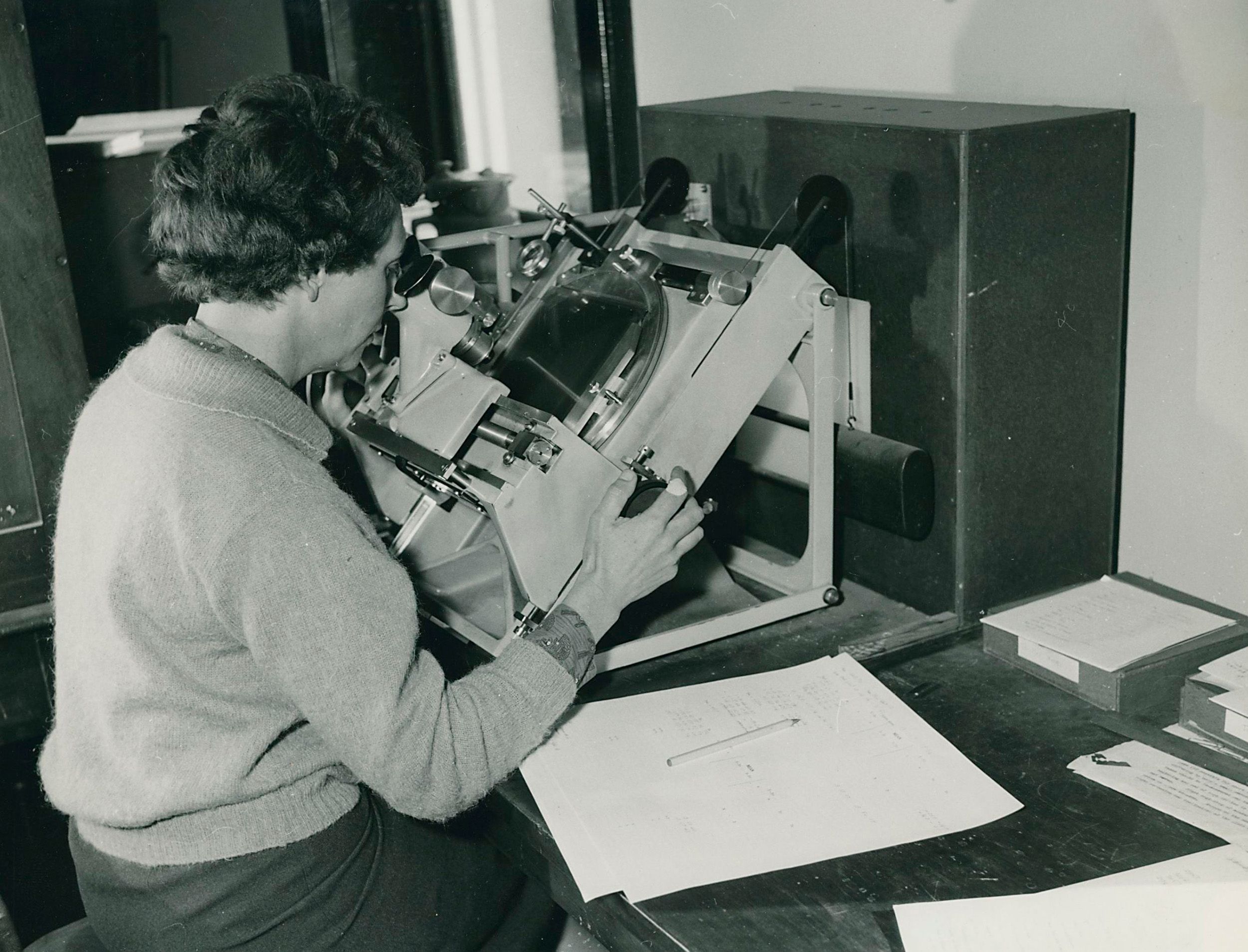 Researcher pressing their head onto a plate measuring machine