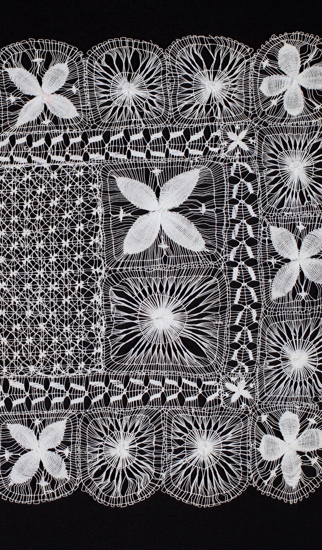 White lace on black background