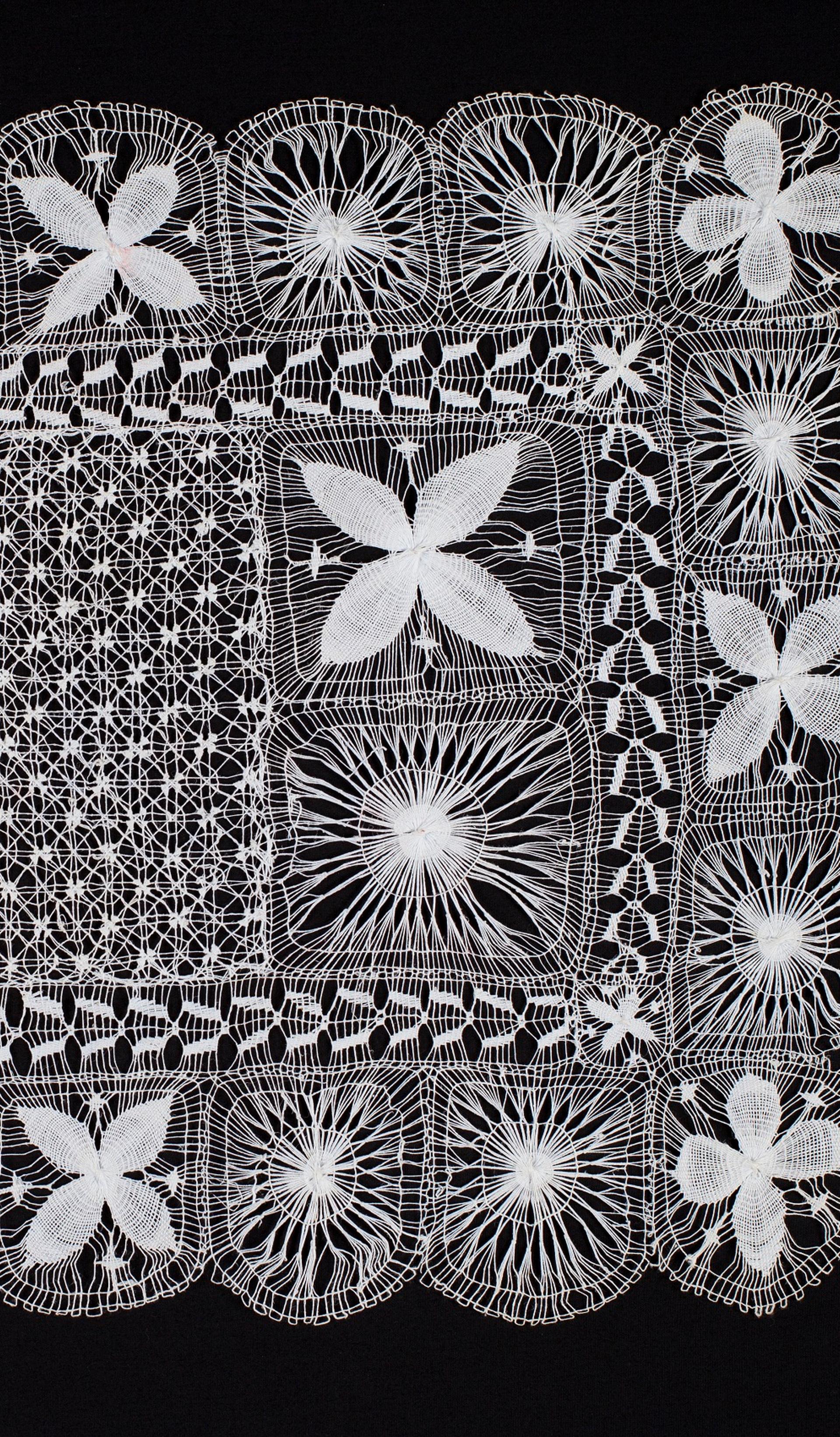 White lace on black background
