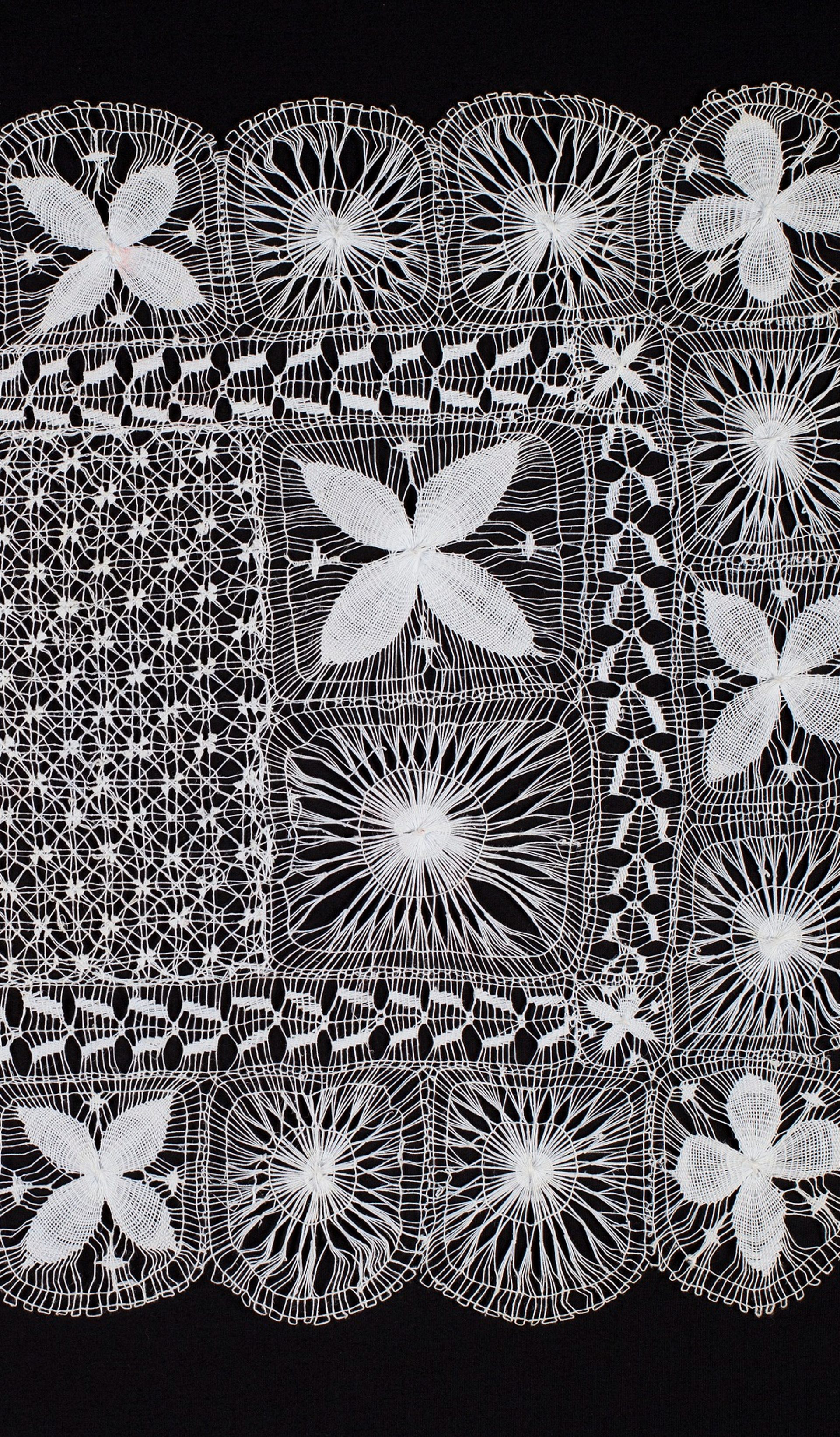 White lace on black background