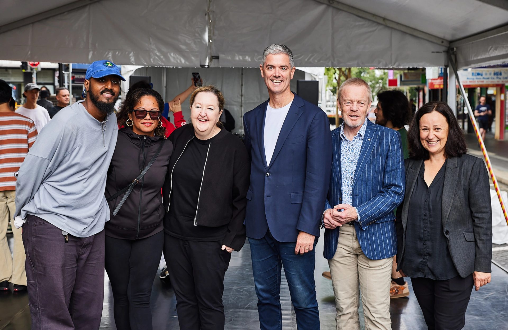 Six people stand for camera.