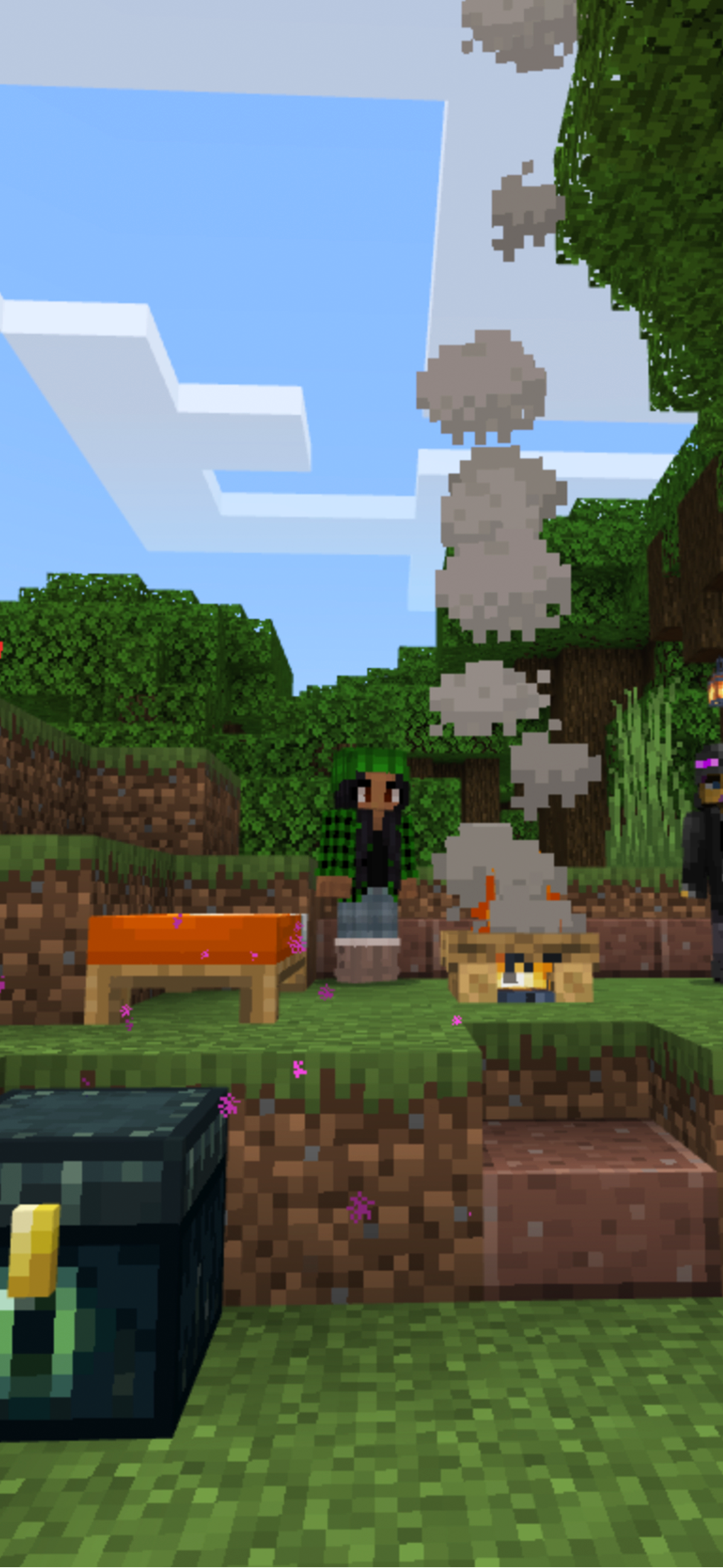 Three Minecraft characters stand in an animated world around a campfire, with a storage chest and a mine cart.