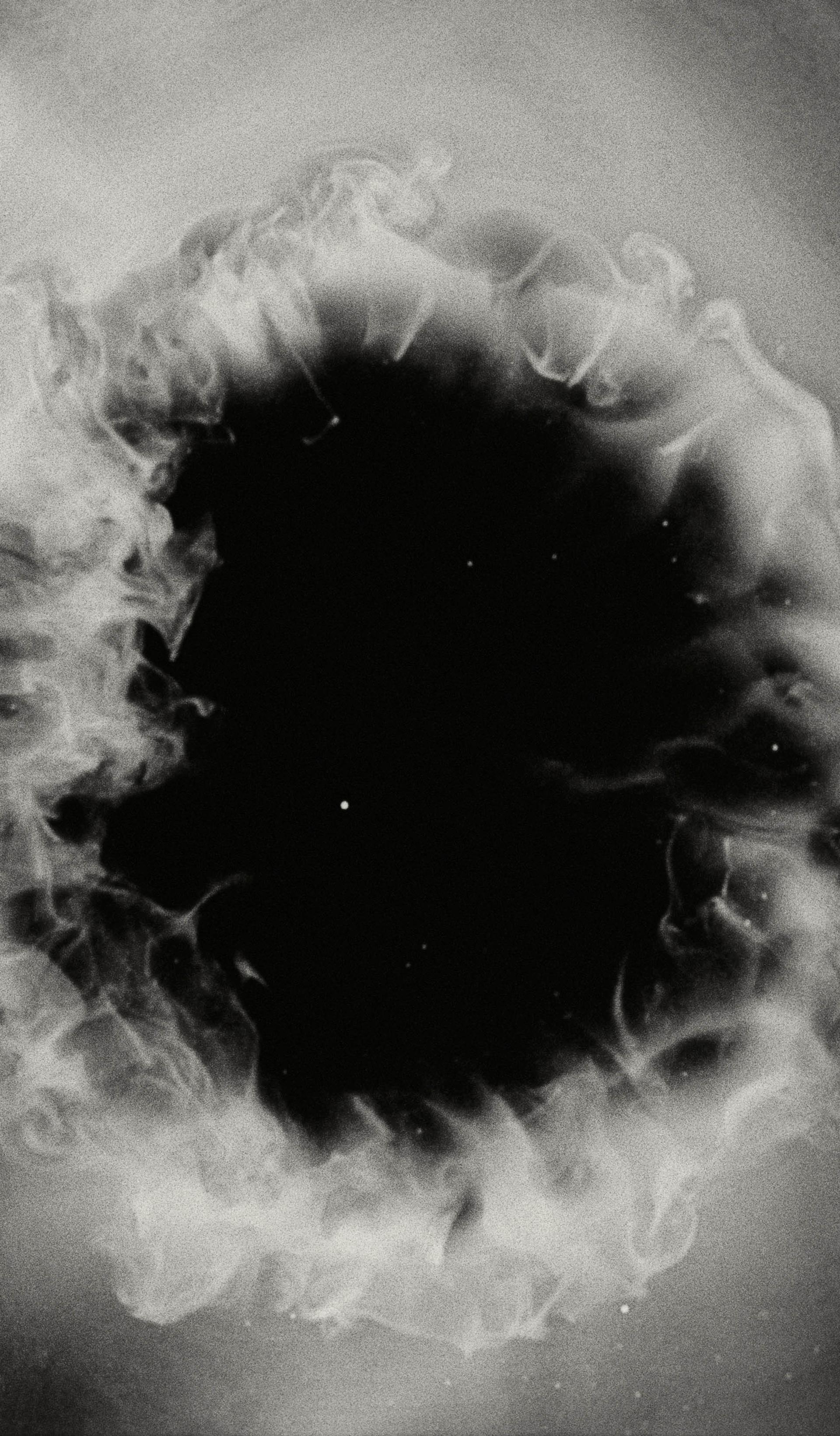 White smoke cloud with a black, starry background.