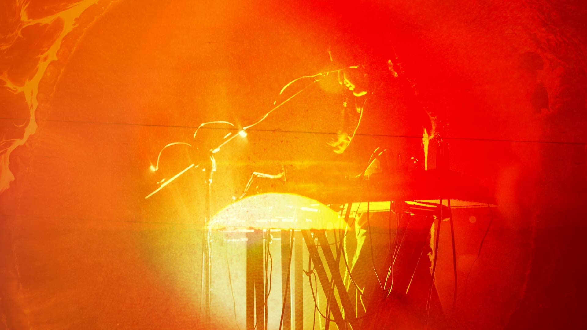 Photo bashed motion image with bright orange sunsets and natural textures over a silhouette of musician Aarti Jadu.